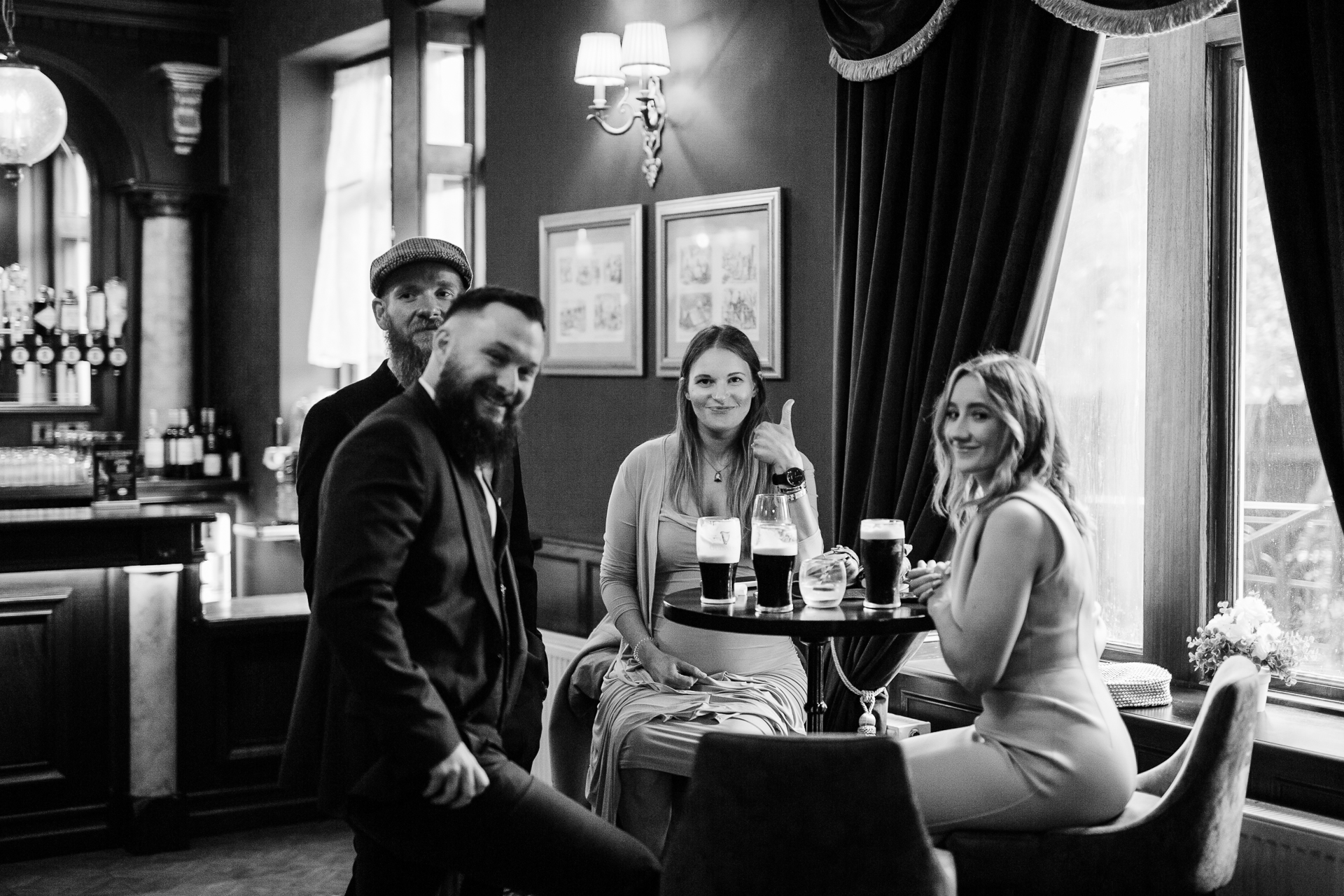 A group of people sitting at a table with drinks