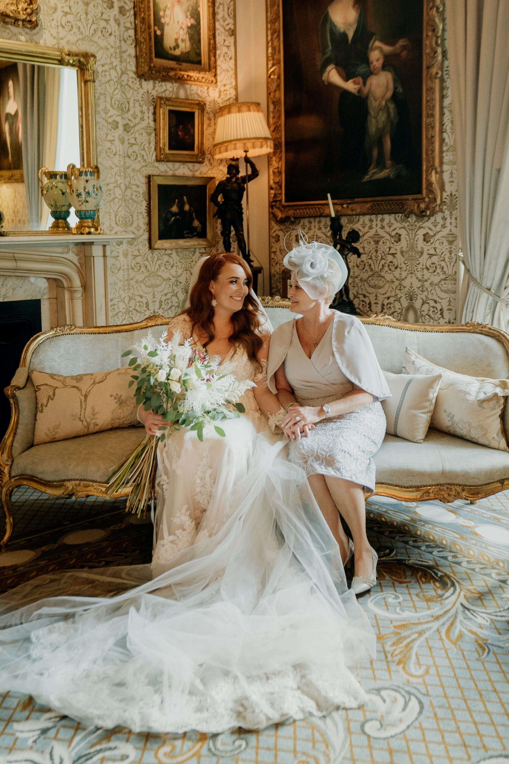 A person in a white dress sitting on a person in a white dress