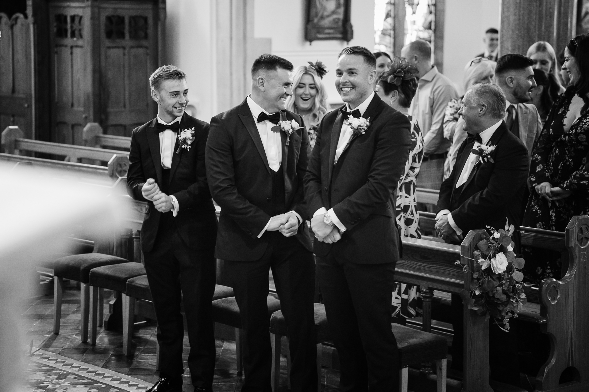 A group of men in suits walking down a hall