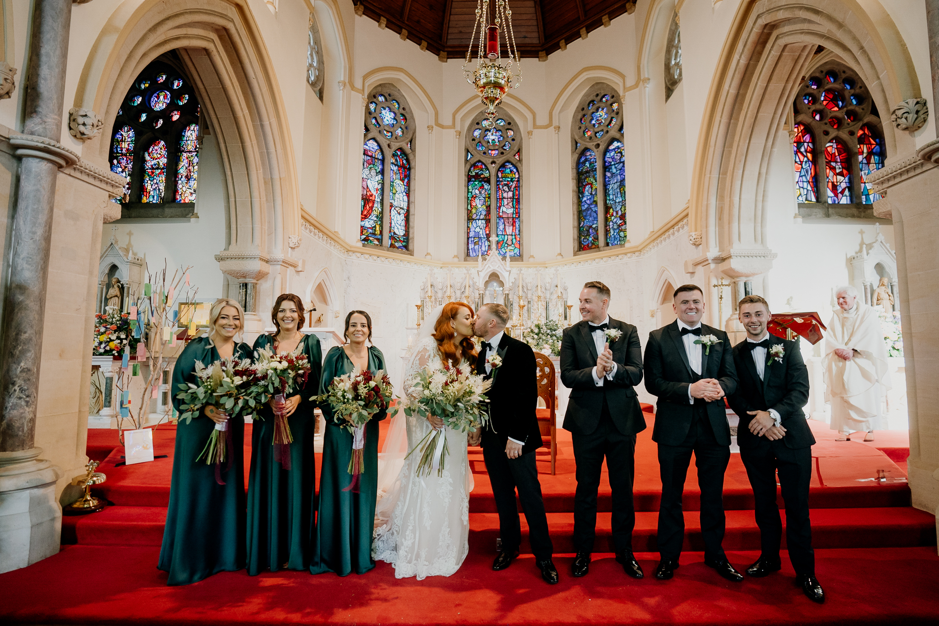 A group of people posing for a photo in a church