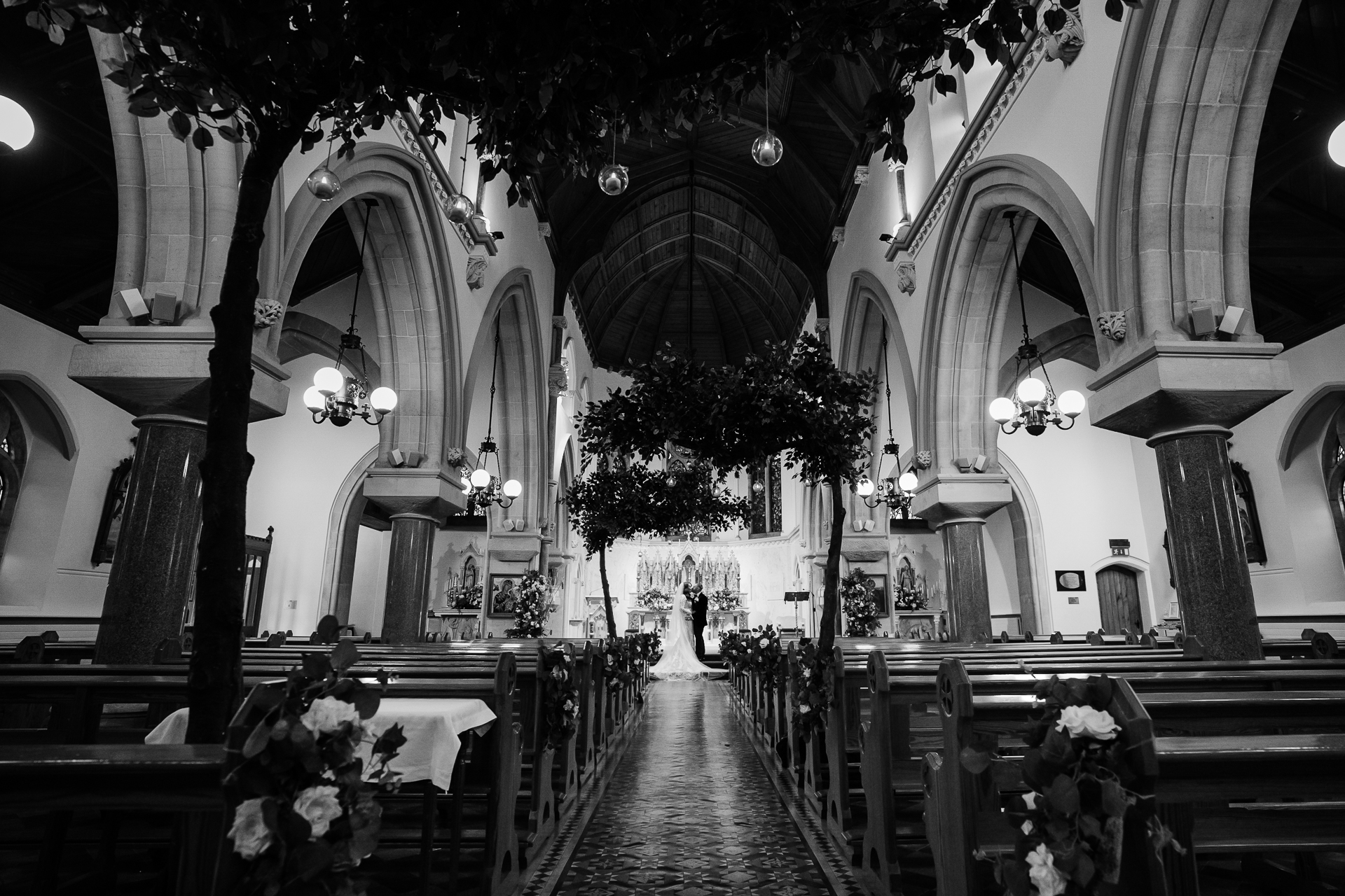 A large church with many arches and flowers