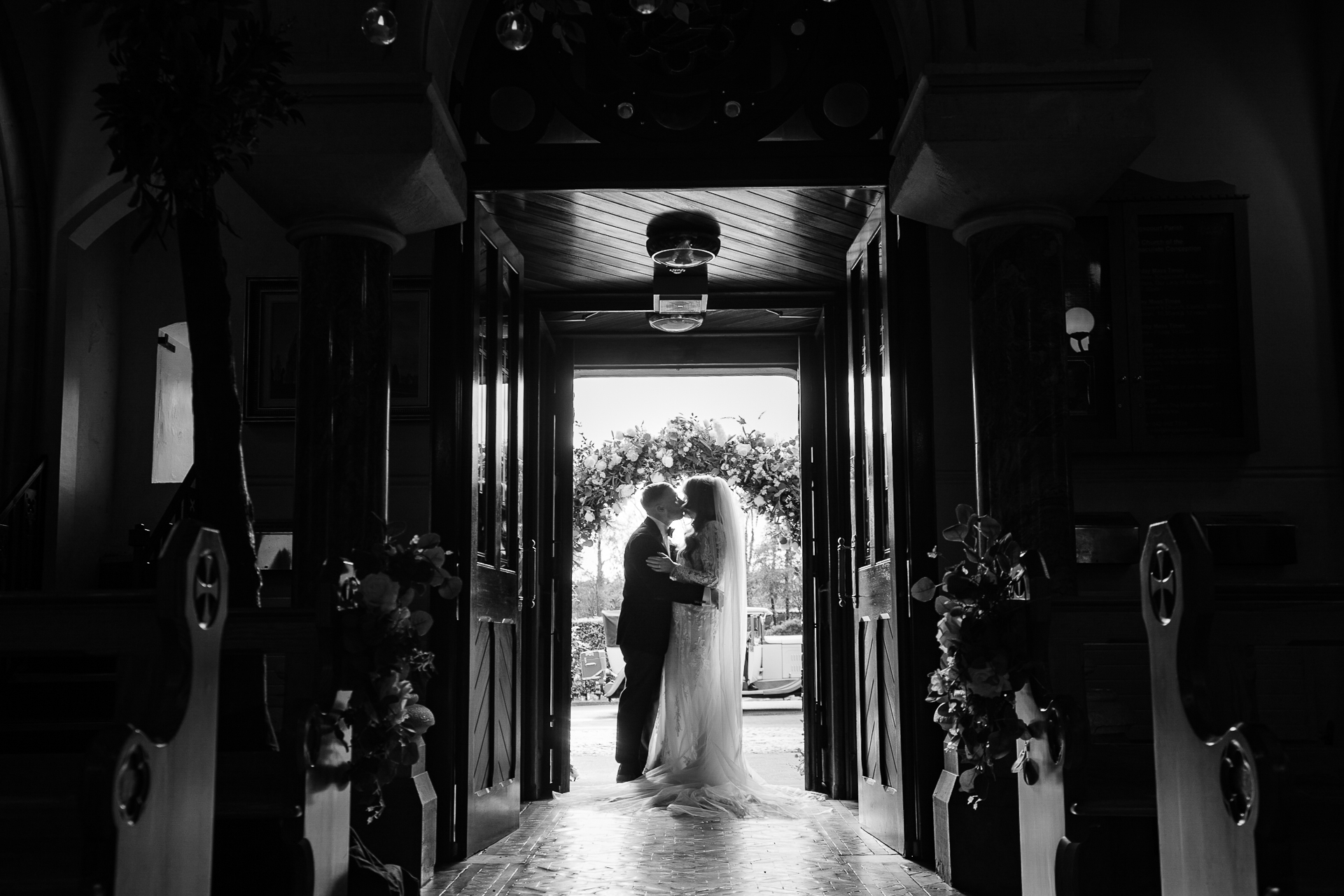 A bride and groom walking down the aisle