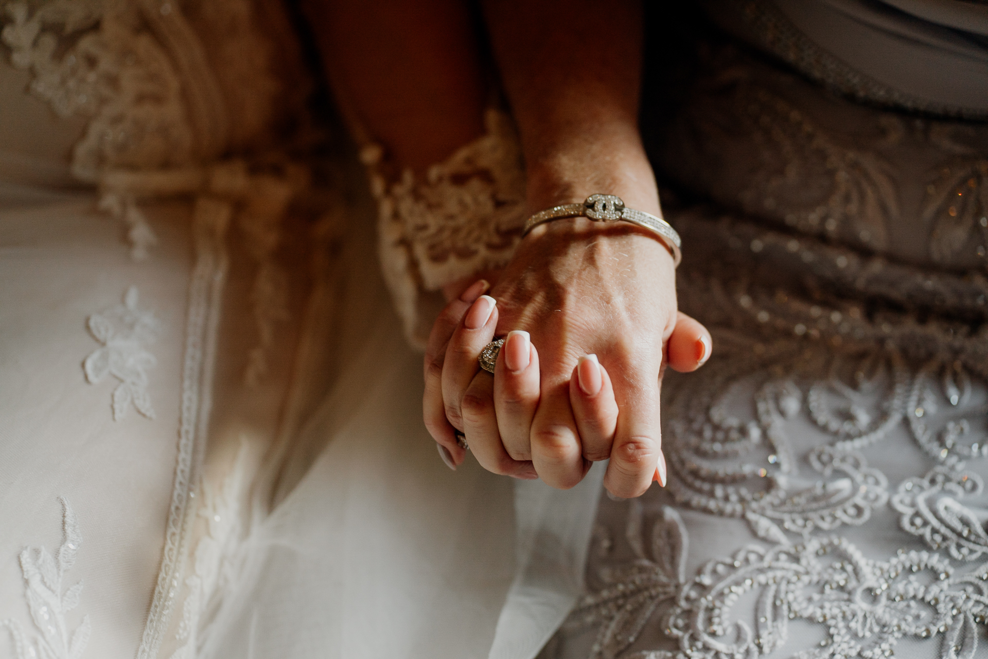 A pair of hands on a white surface