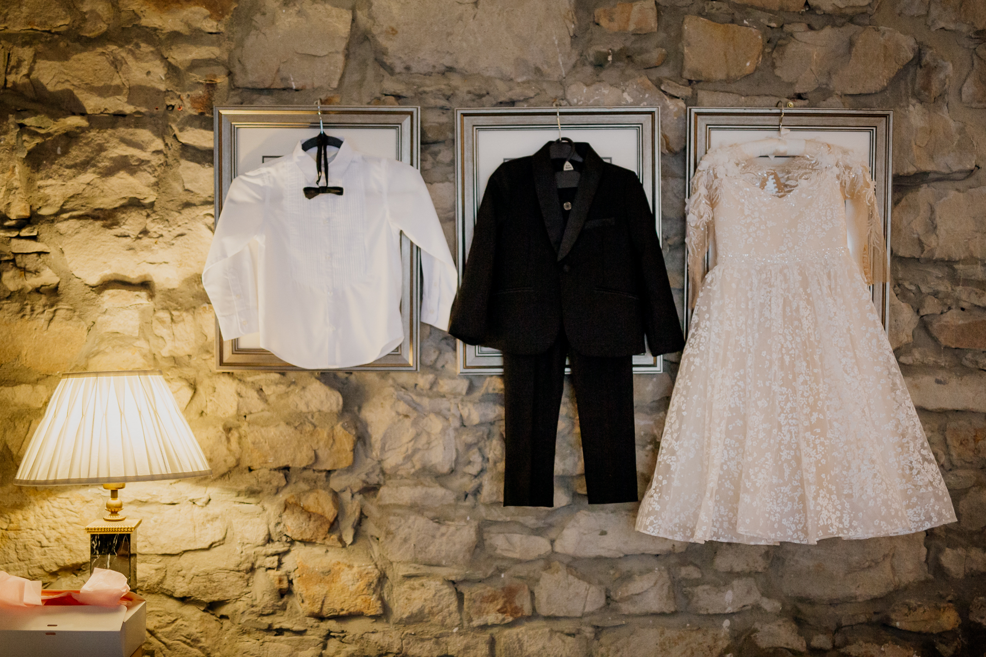 A couple of wedding dresses on a wall