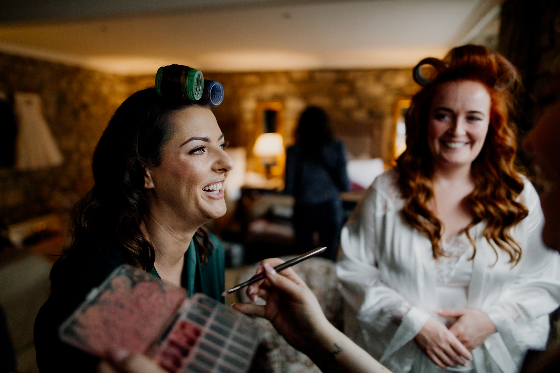 A woman holding a book and another woman looking at her