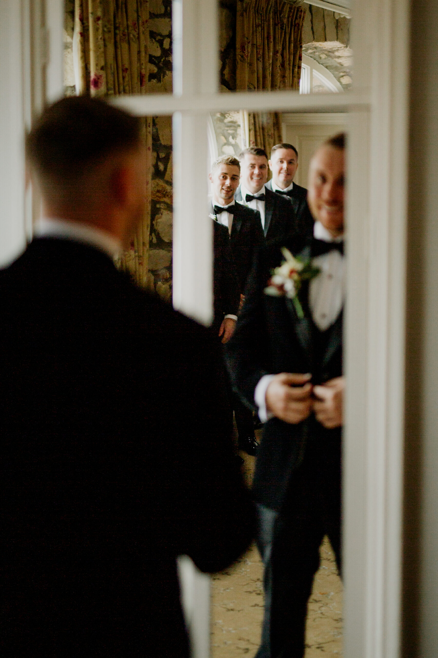 A person in a suit and tie looking at a person in a suit