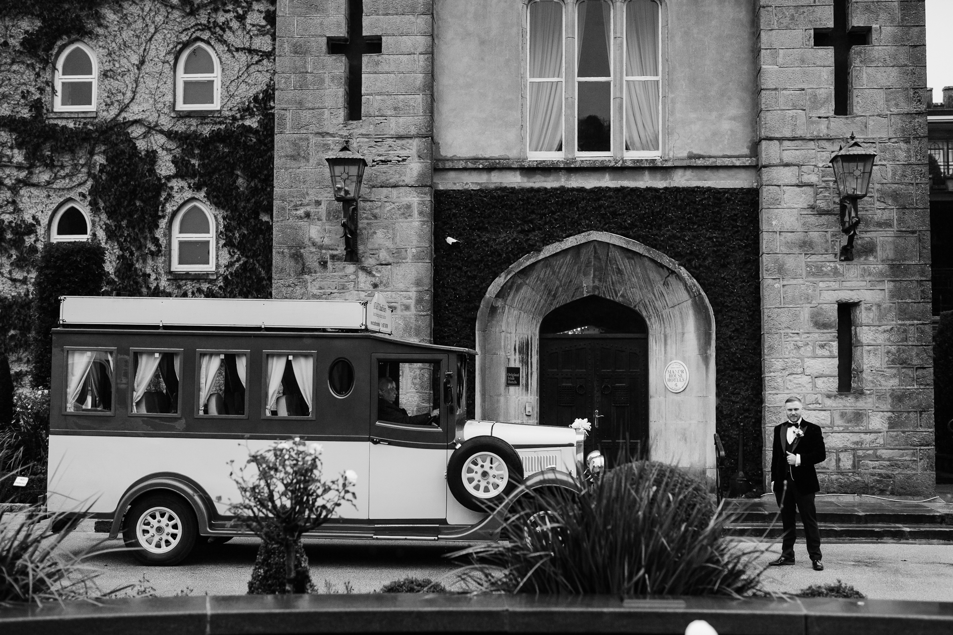 A person standing next to a bus