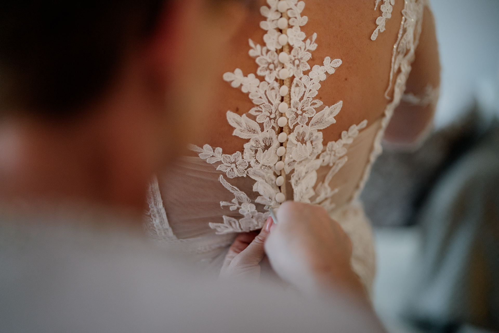 A person holding a white flower