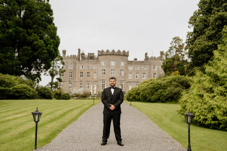 A person standing in front of a large building