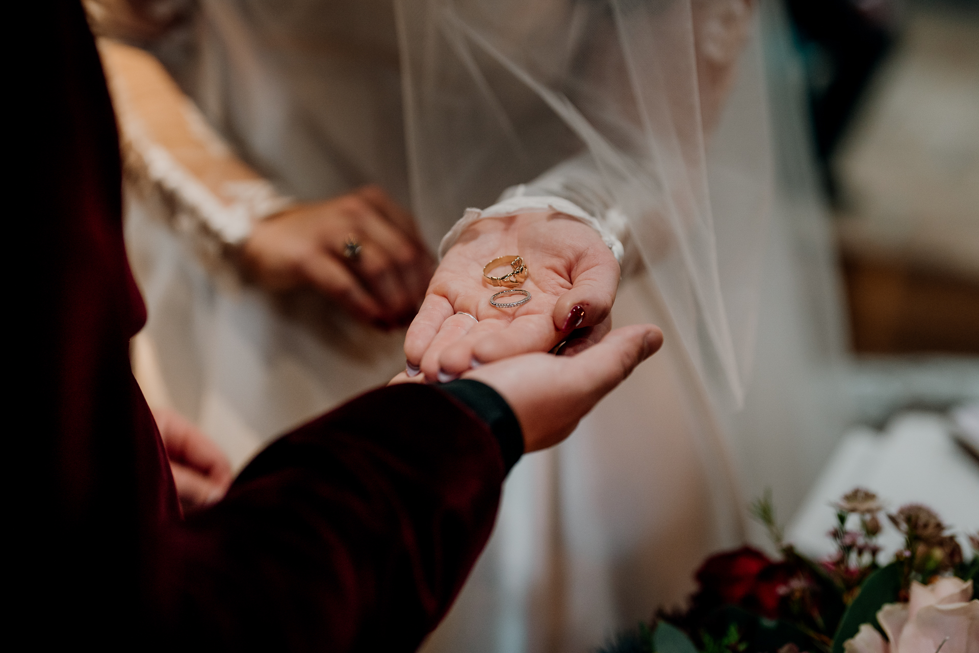 A person holding a gold ring