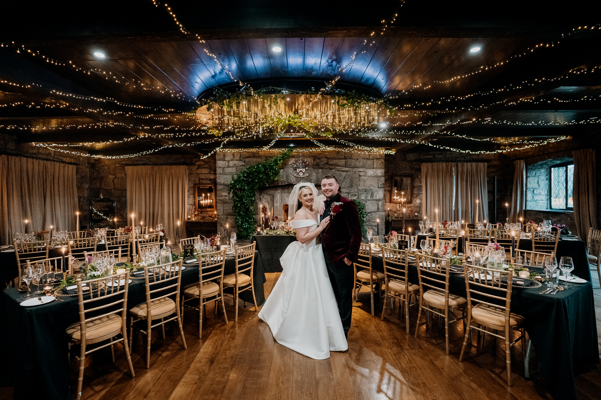 A man and woman in a fancy room with tables and chairs