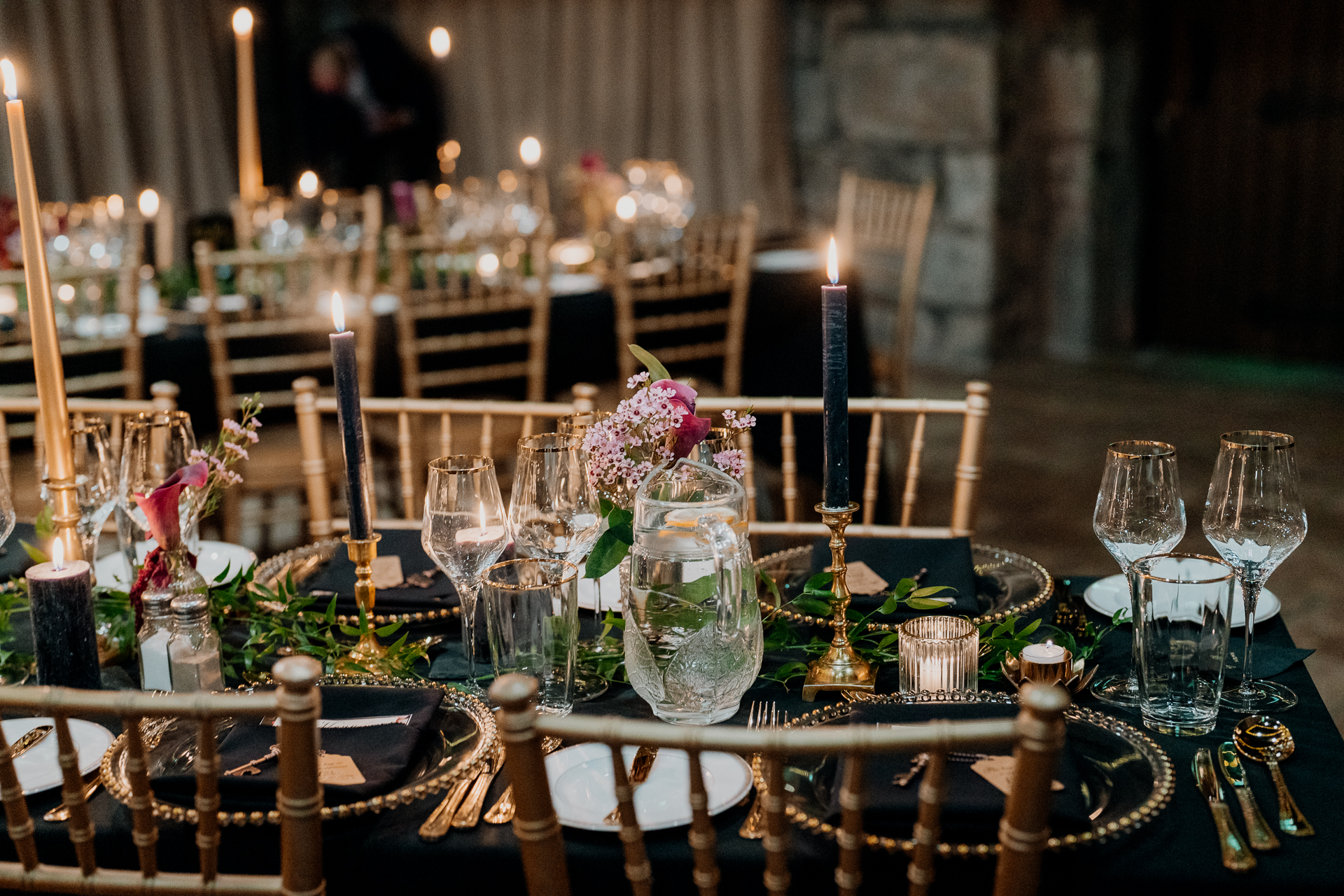 A table with candles and glasses