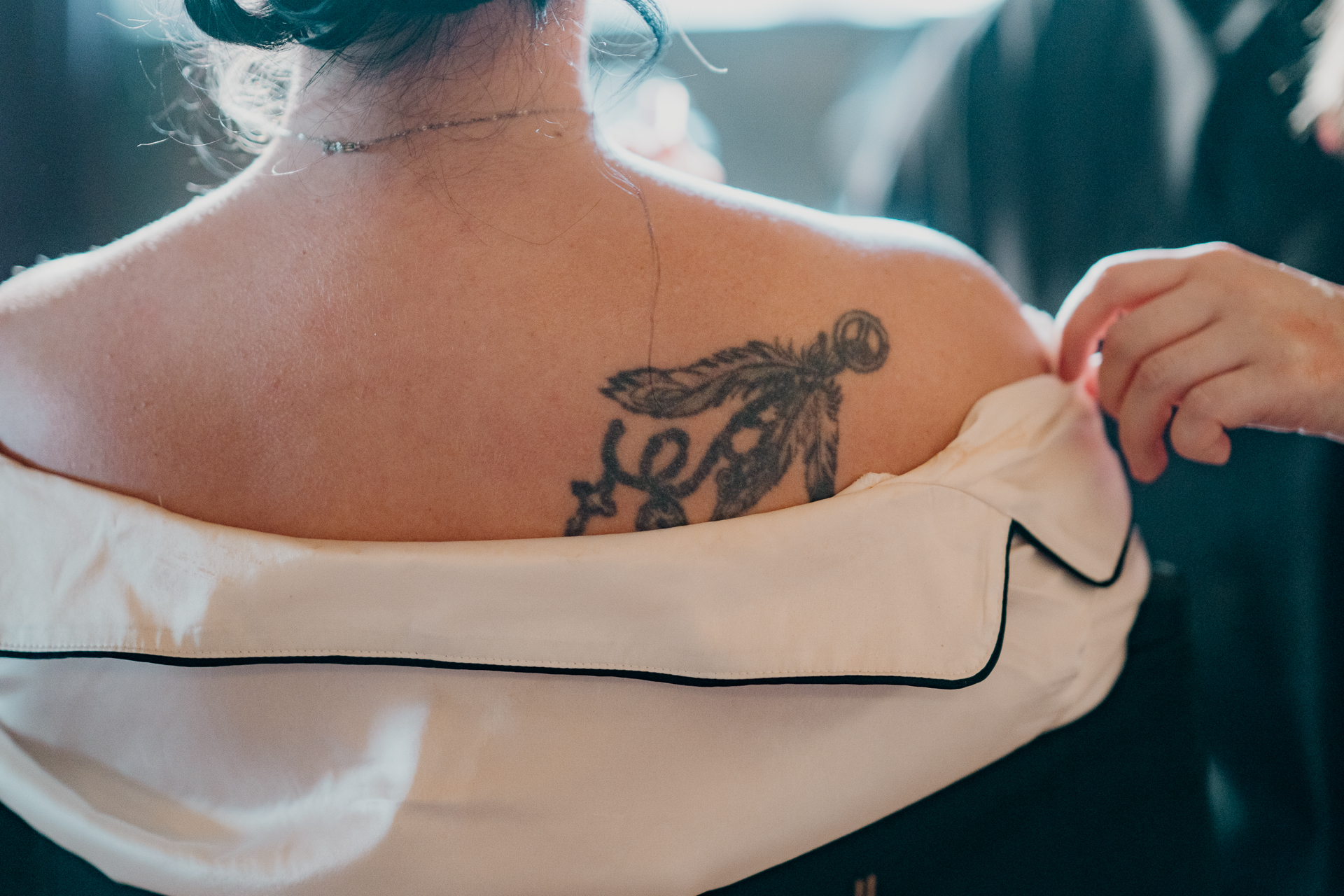 A woman with a tattoo on her back