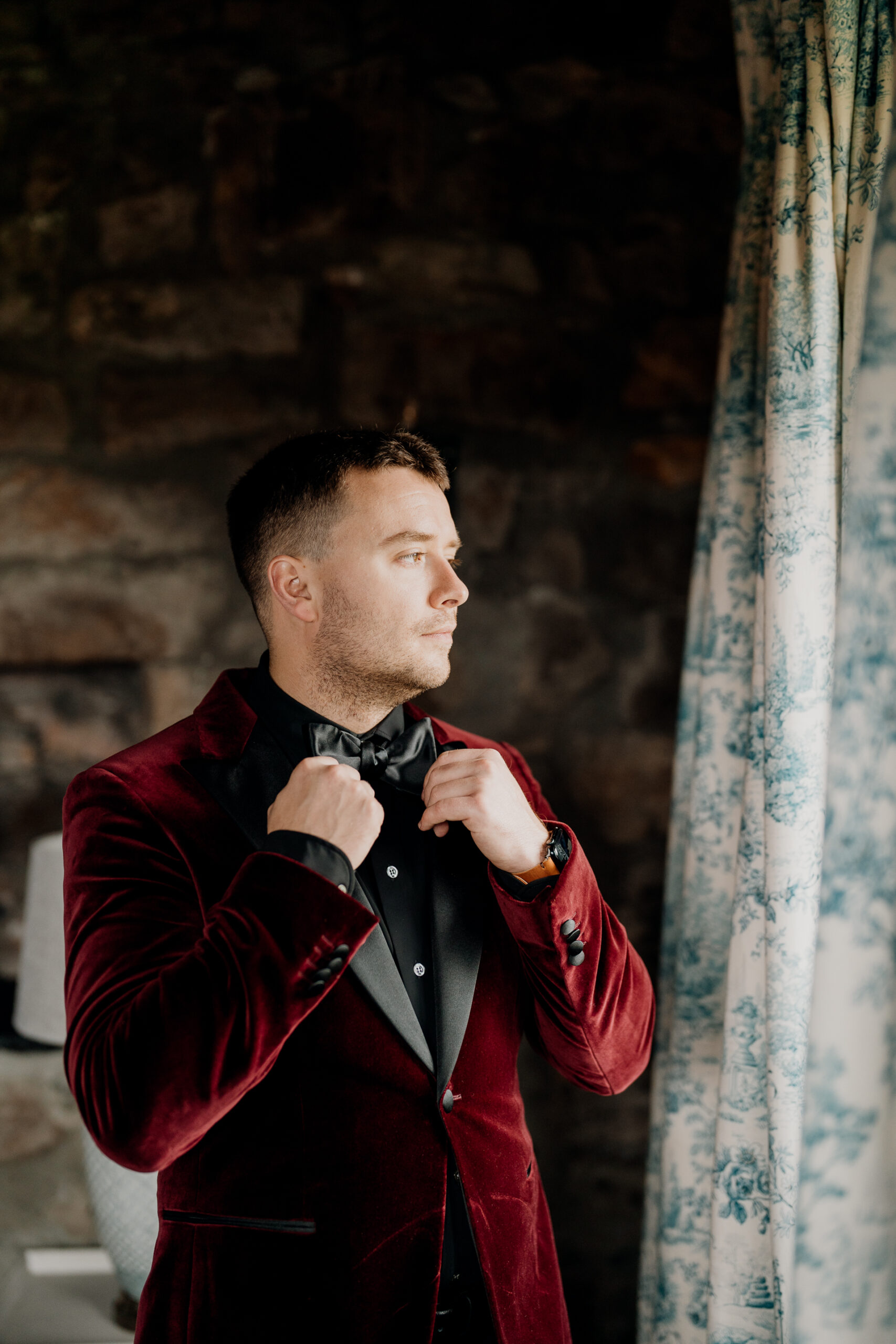 A man adjusting his tie