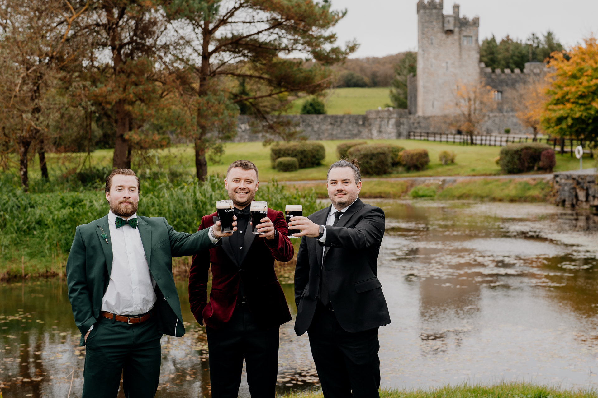 A group of men holding cups and posing for a picture