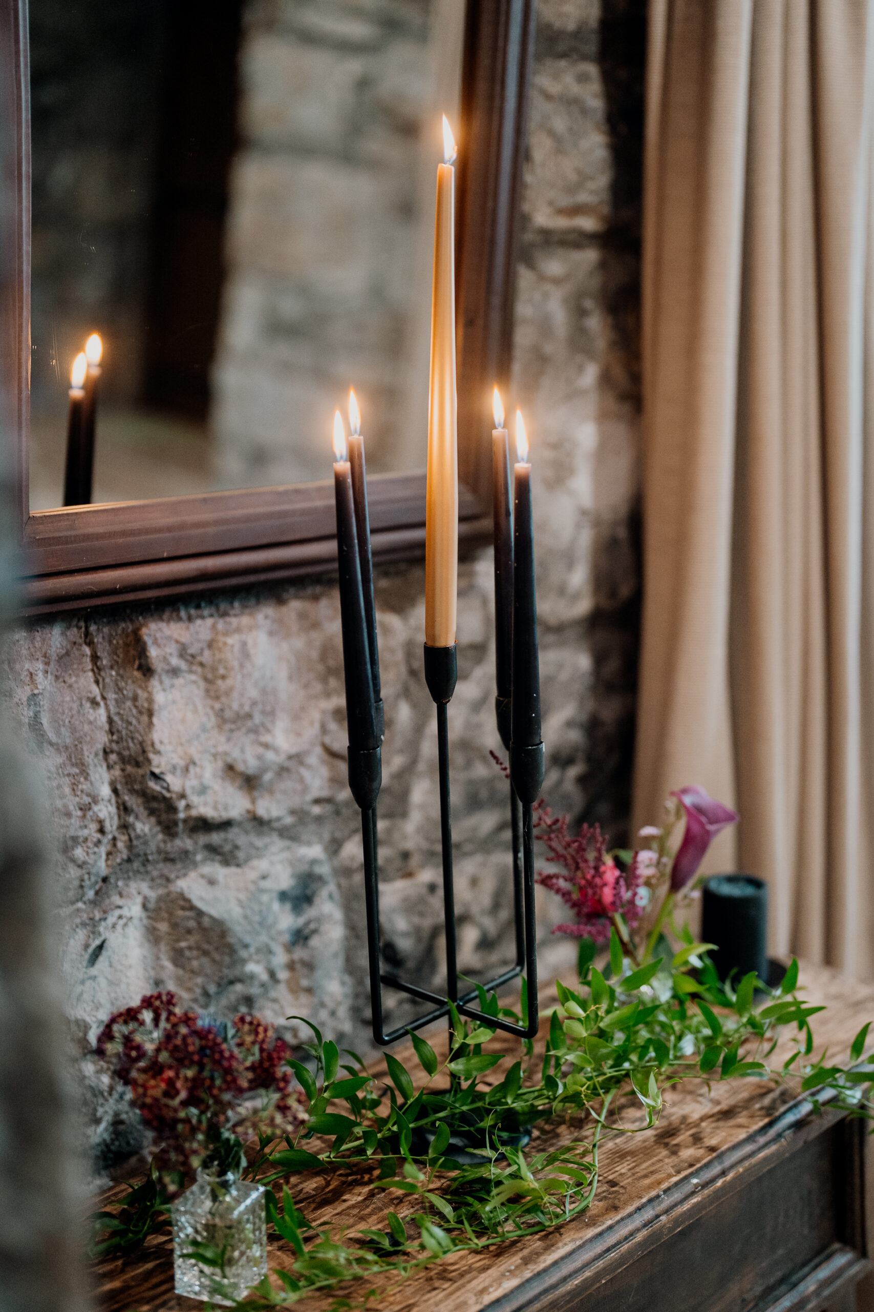 A lit candle on a table