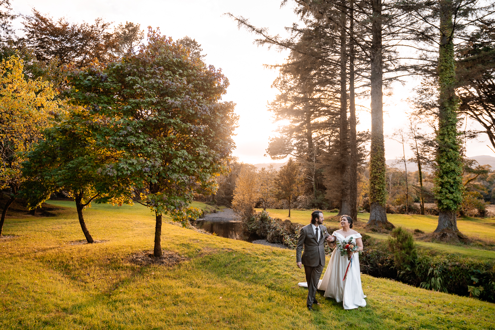 A man and woman walking in a park