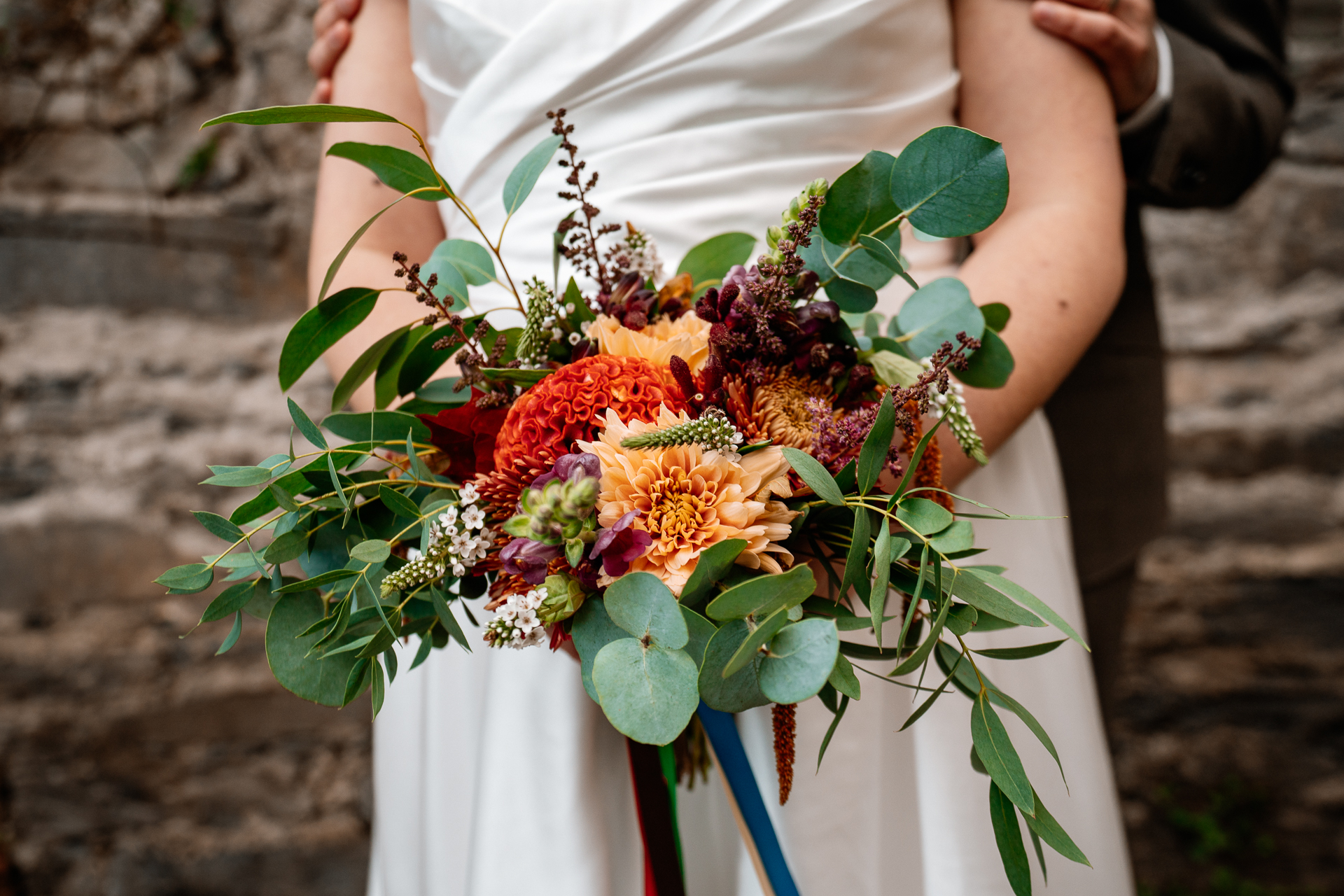 A person holding a bouquet of flowers