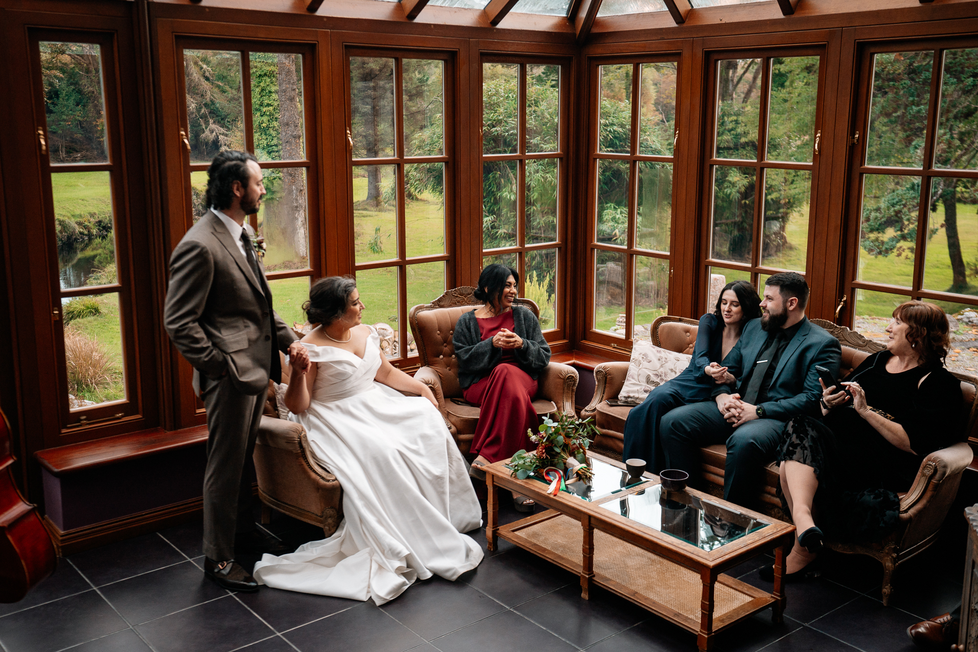 A man and woman in a room with a man in a suit