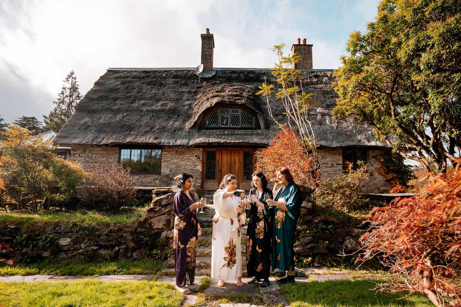 A group of people standing in front of a house