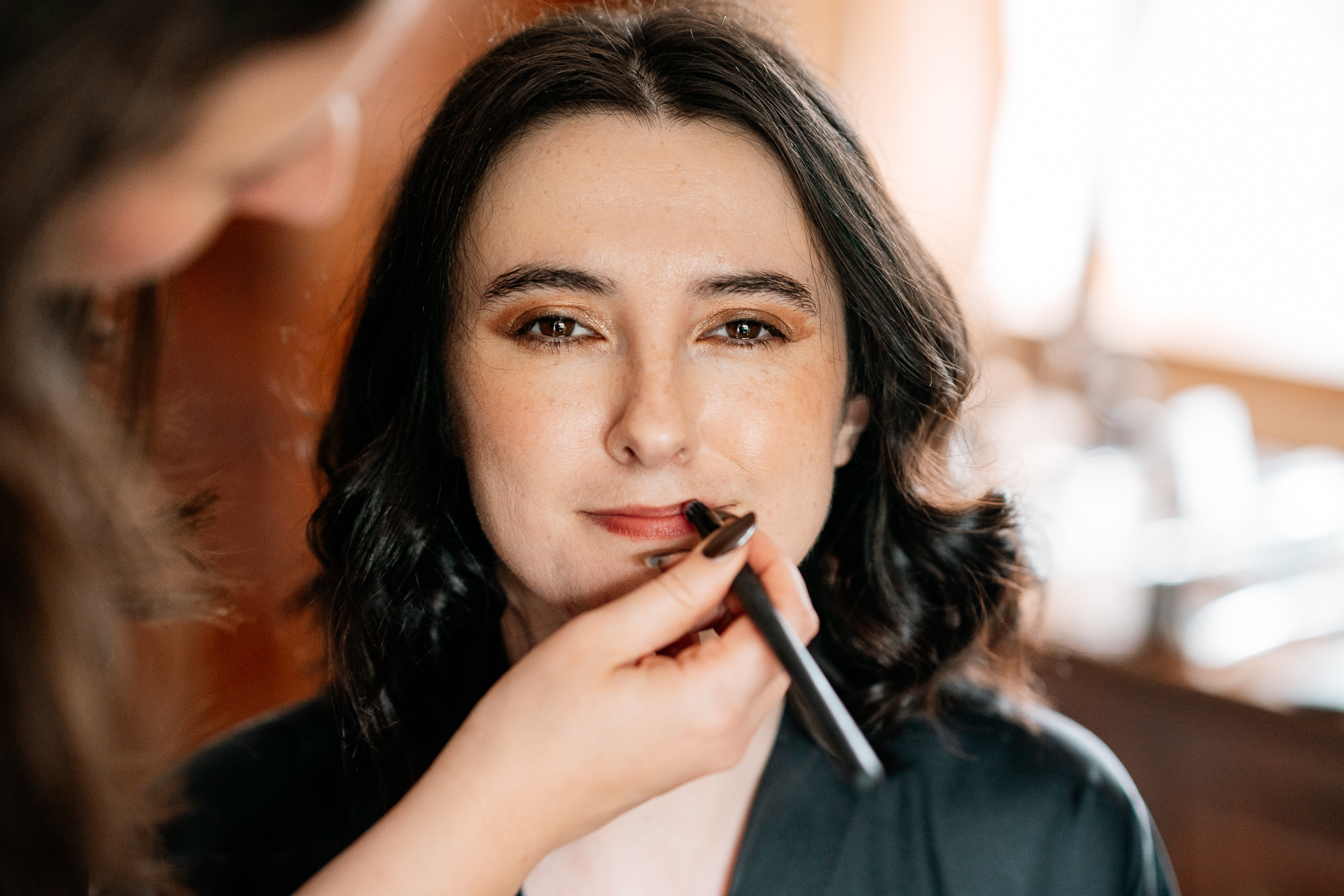 A woman holding a pen