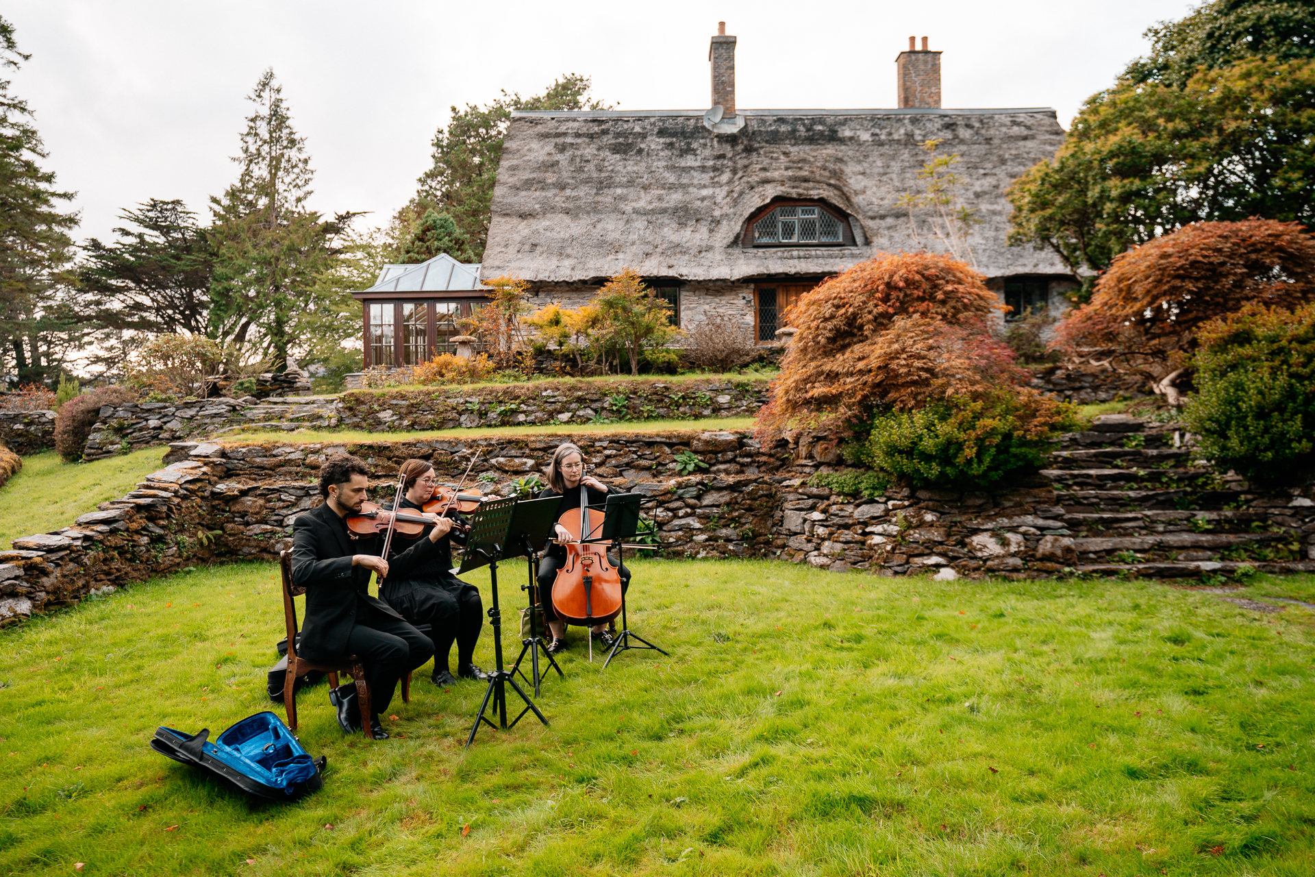 A group of people playing instruments outside