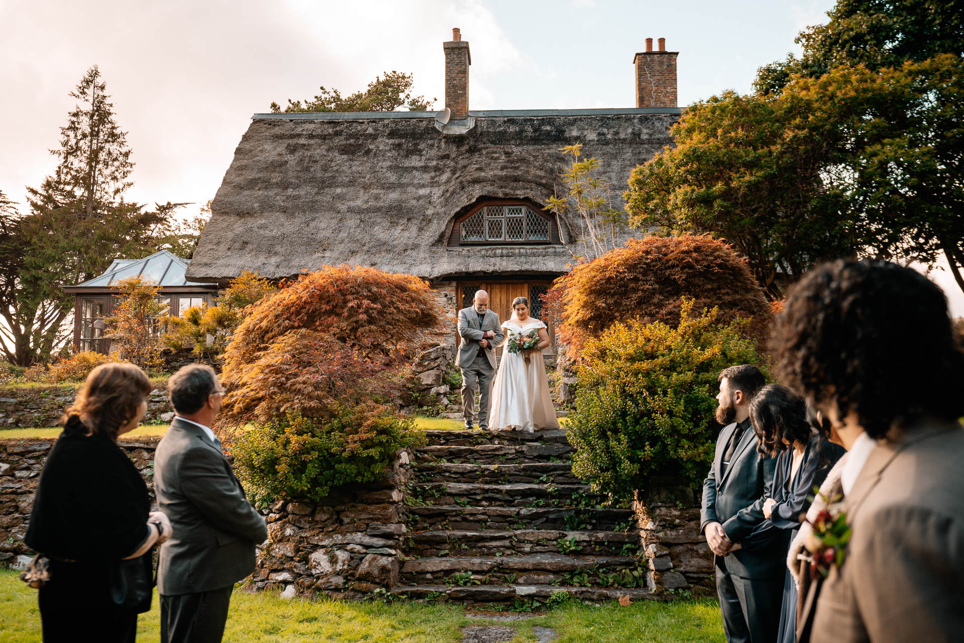 A wedding ceremony in front of a house