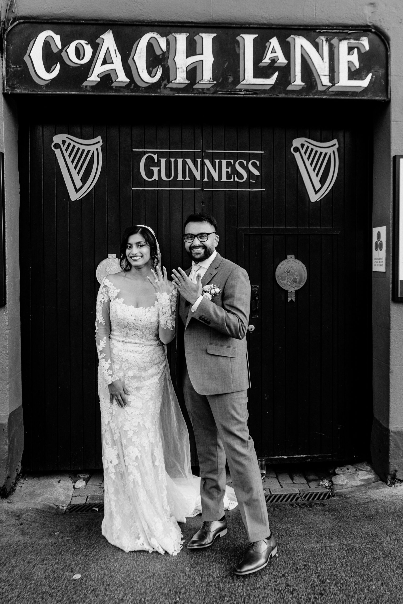 A man and woman posing for a picture in front of a store