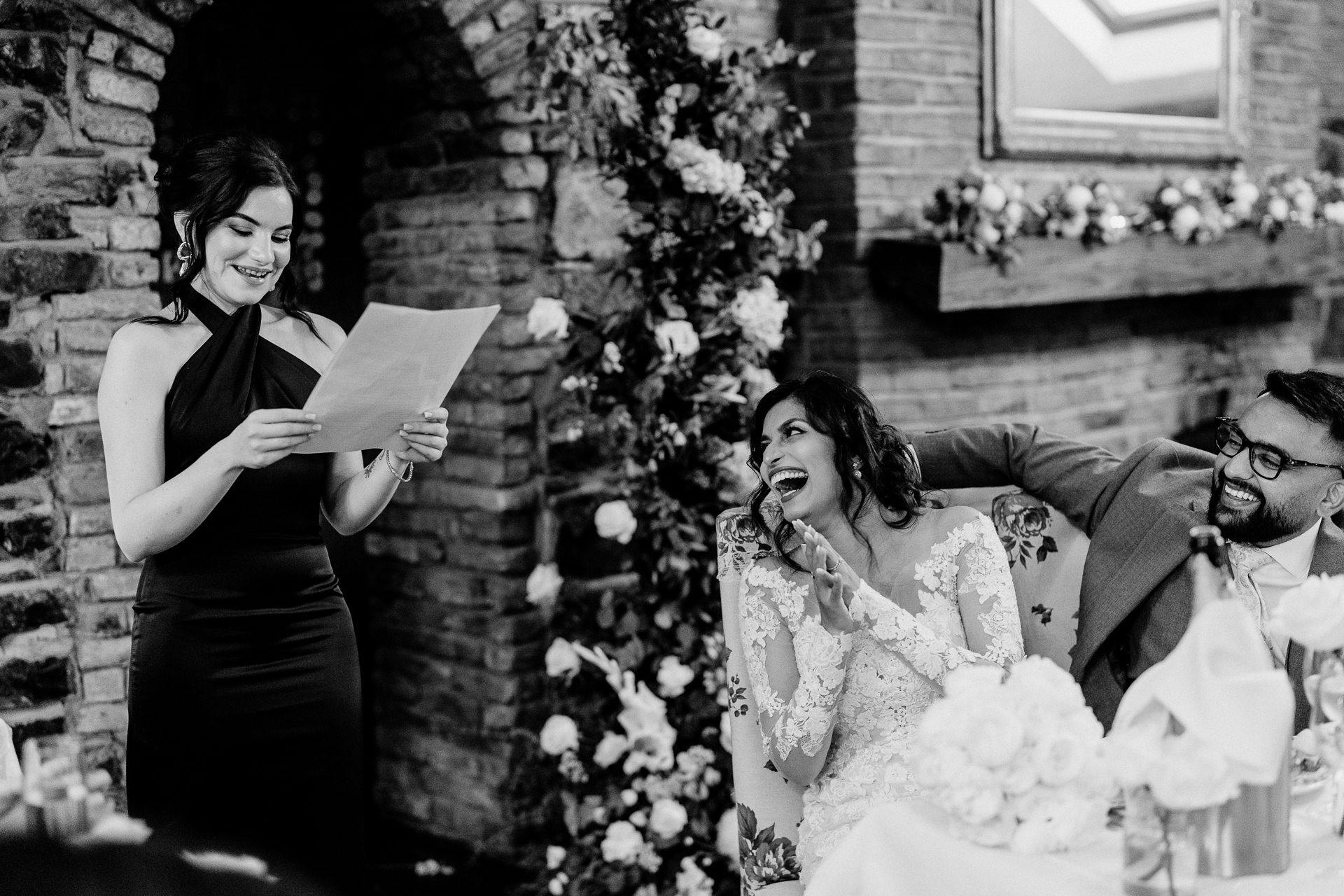 A bride and groom holding a bouquet