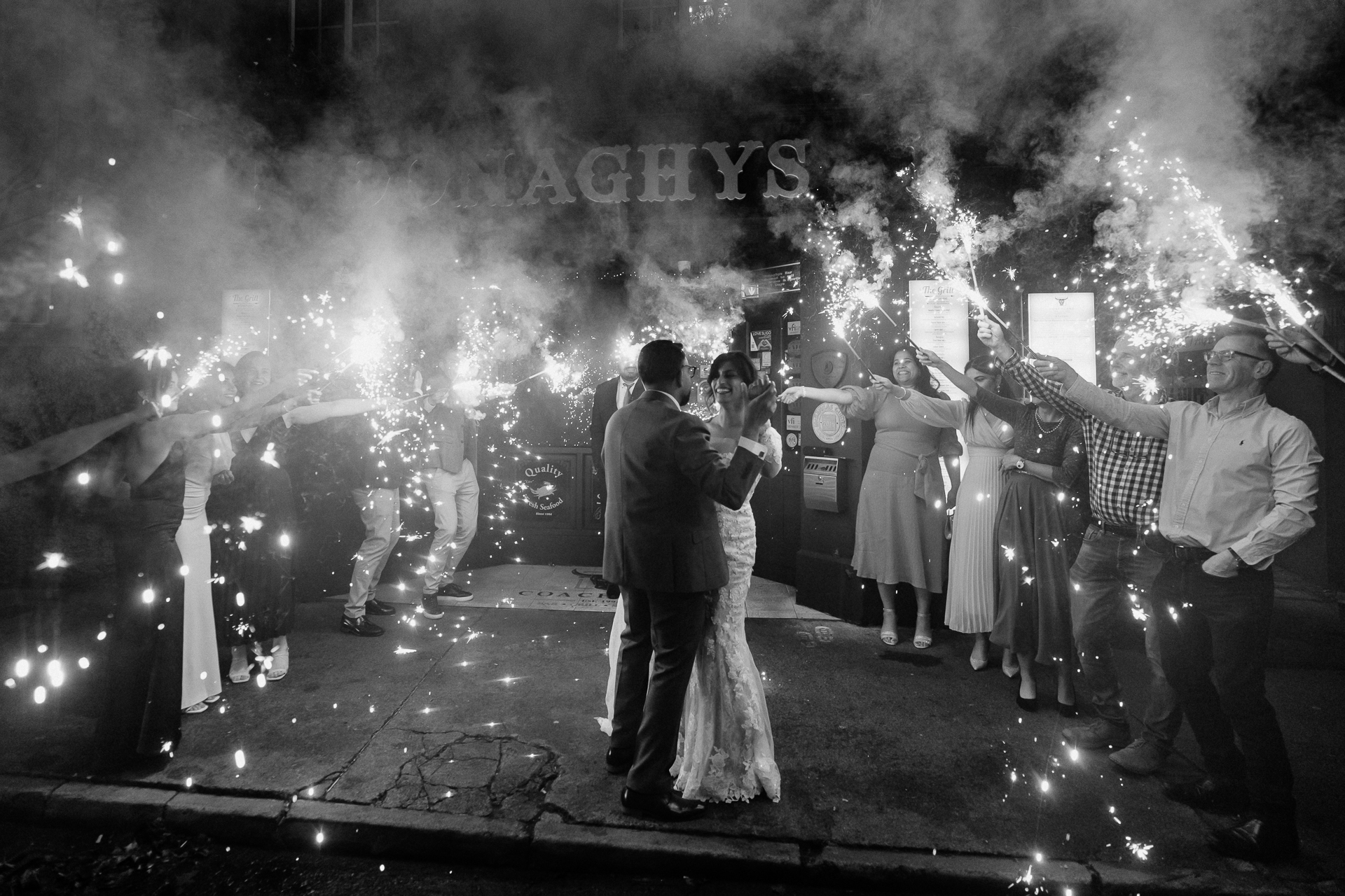 A group of people standing in front of a burning building