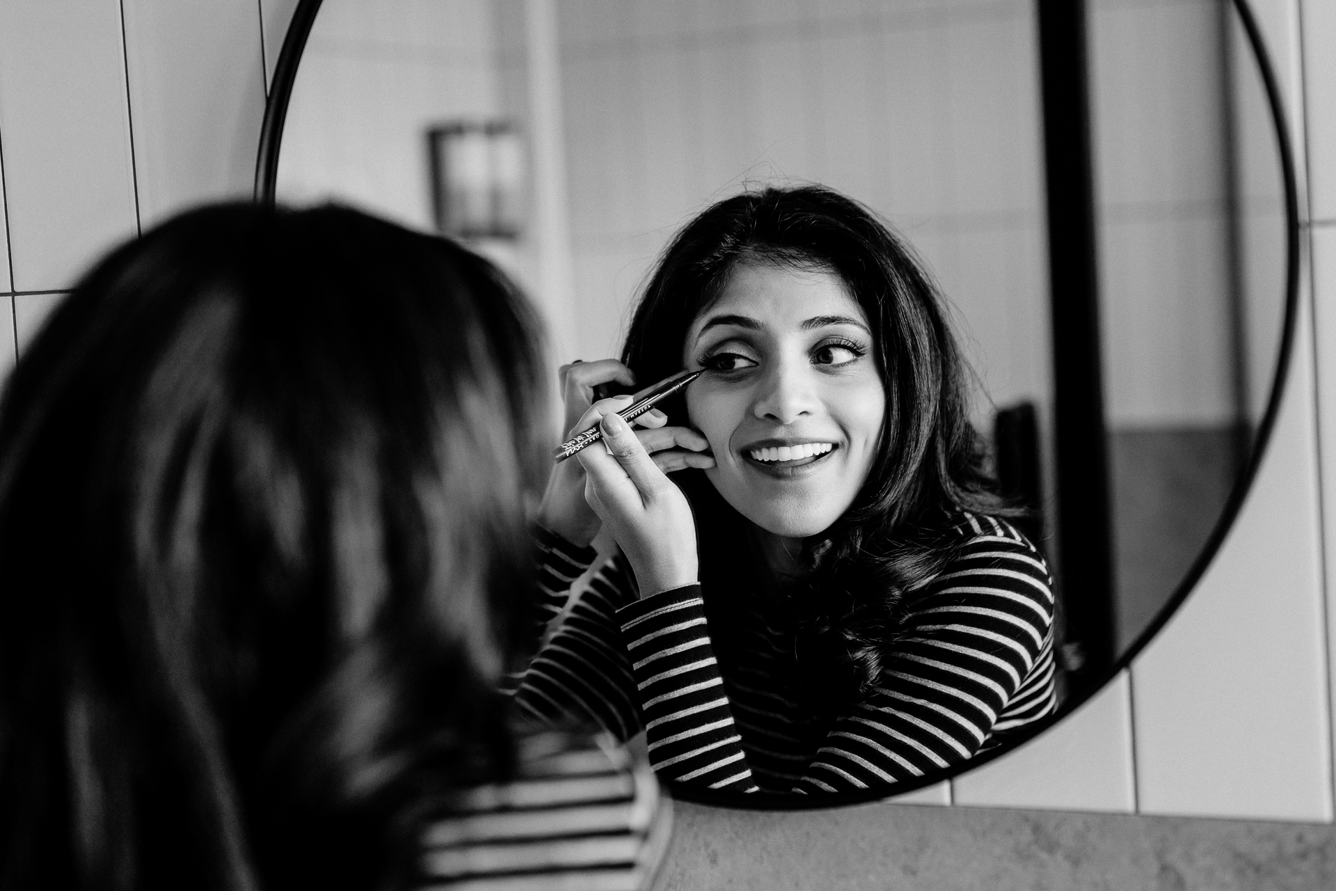 A woman smiling at another woman