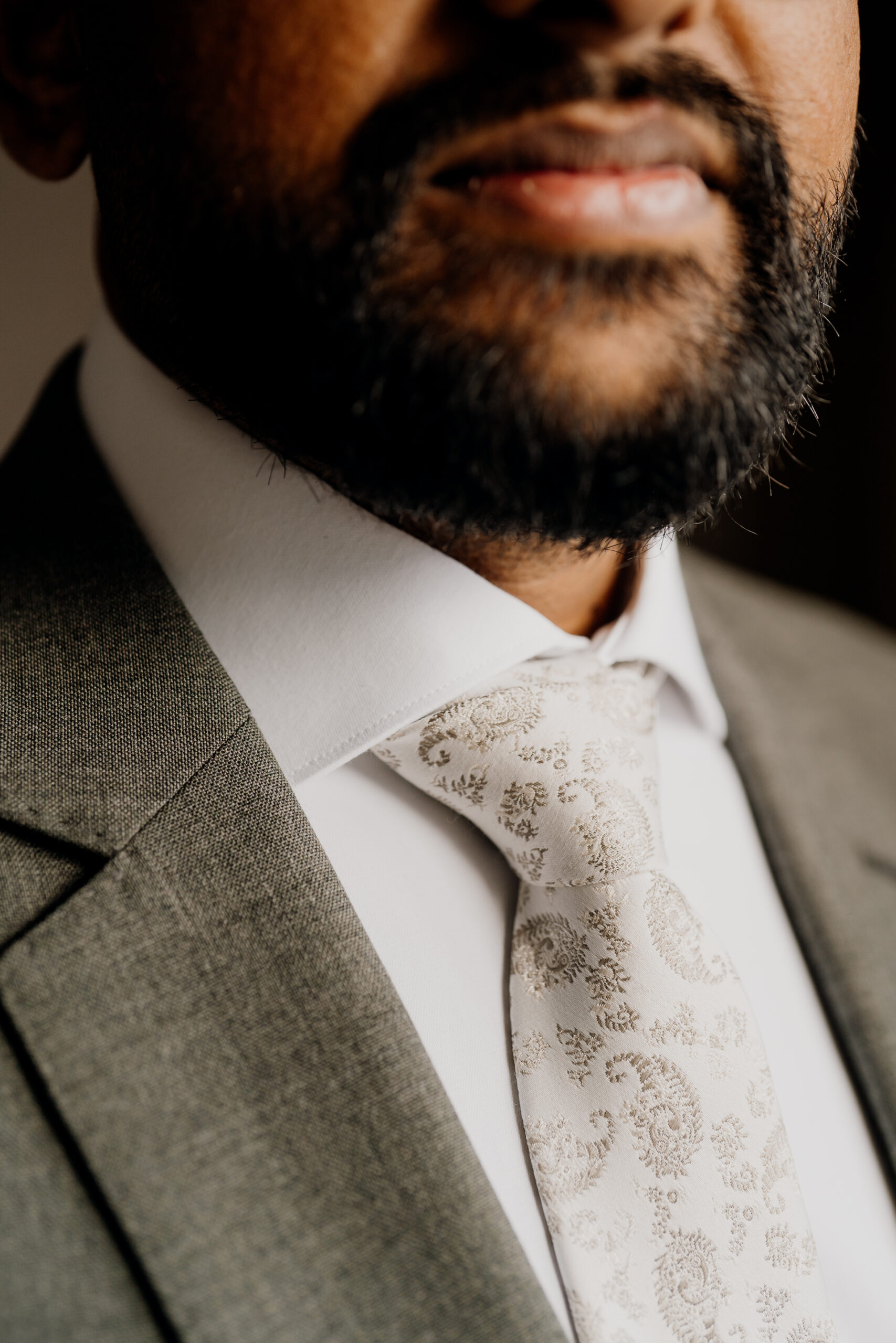 A man wearing a suit and tie