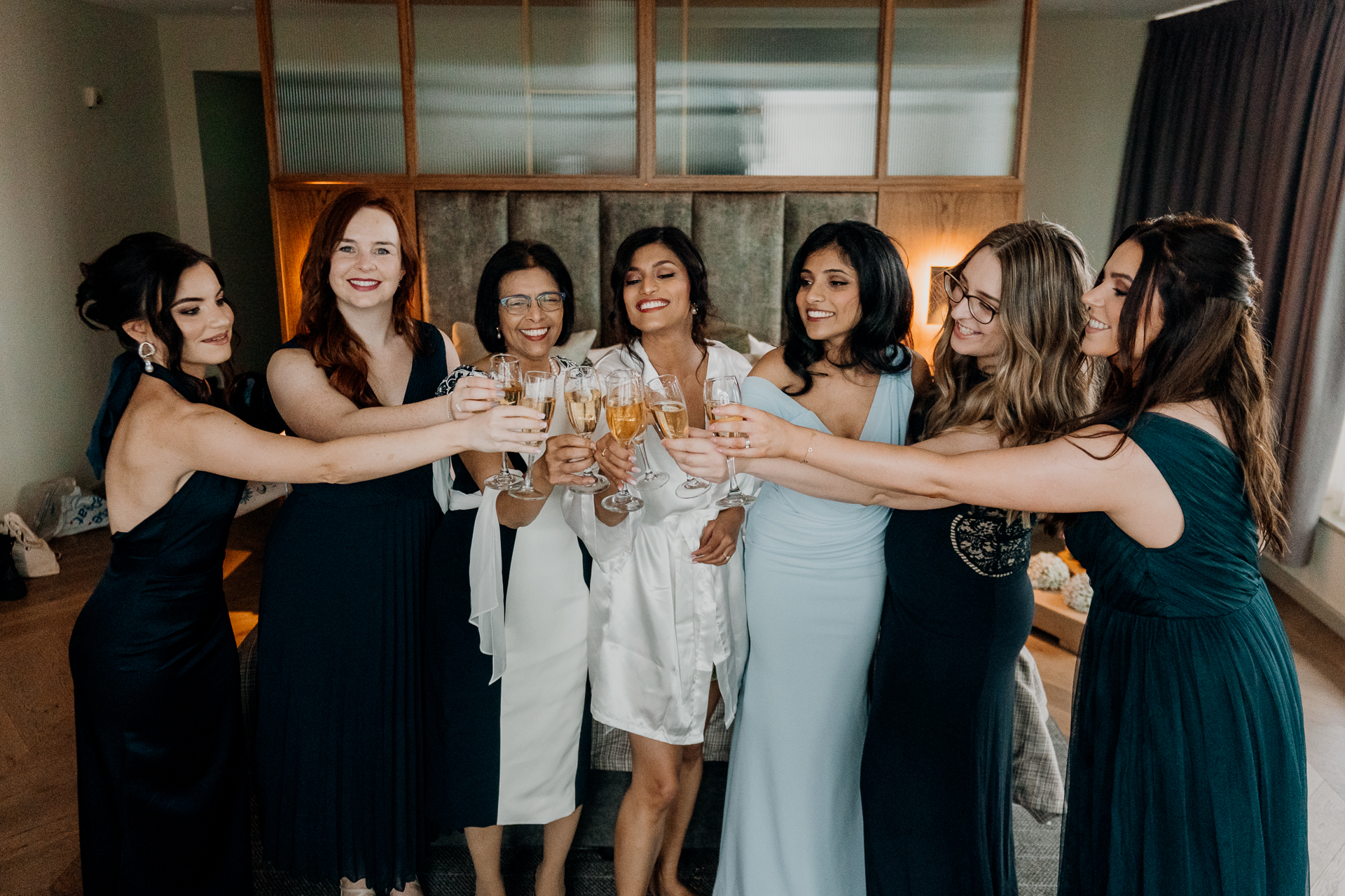 A group of women holding wine glasses