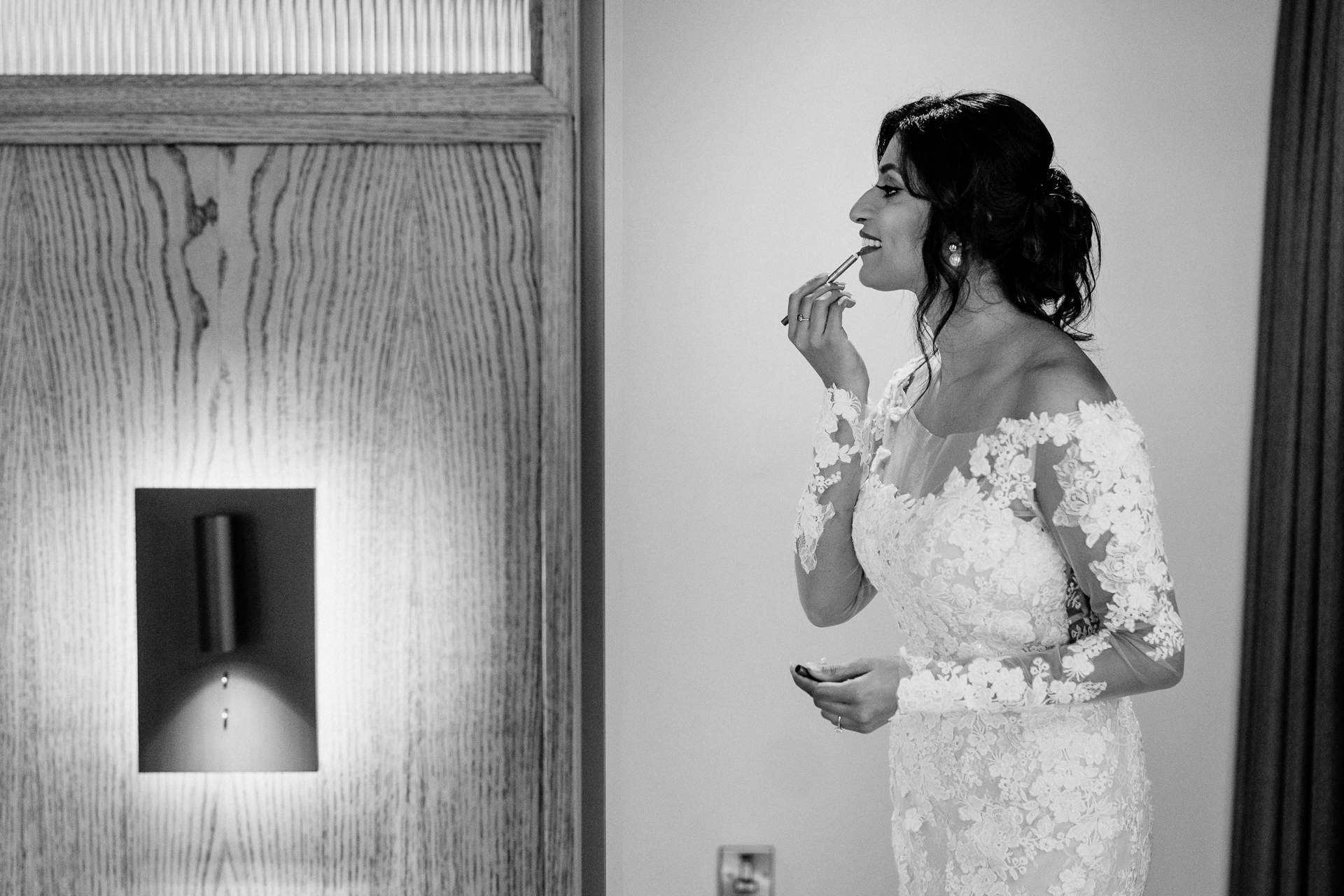 A person in a wedding dress smoking a cigarette