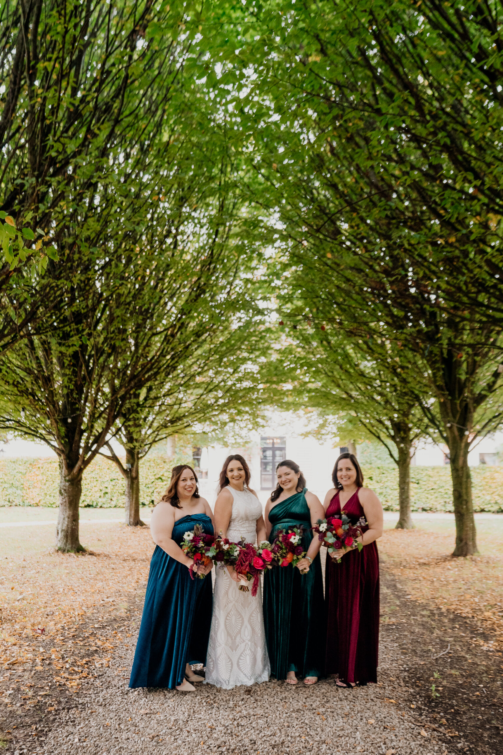 Bridesmaids enjoying a moment in the garden of Barberstown Castle.