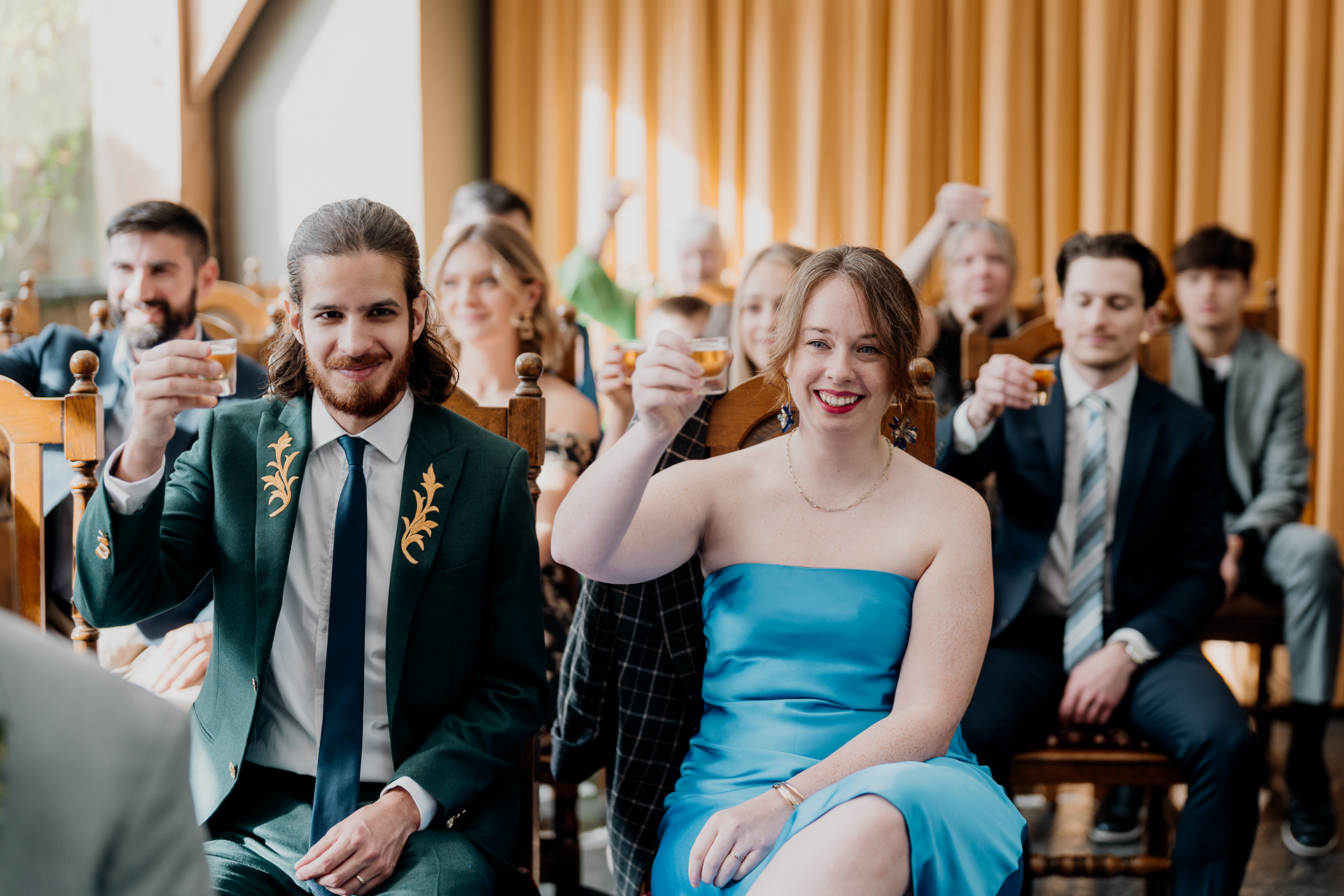 A group of people sitting and standing