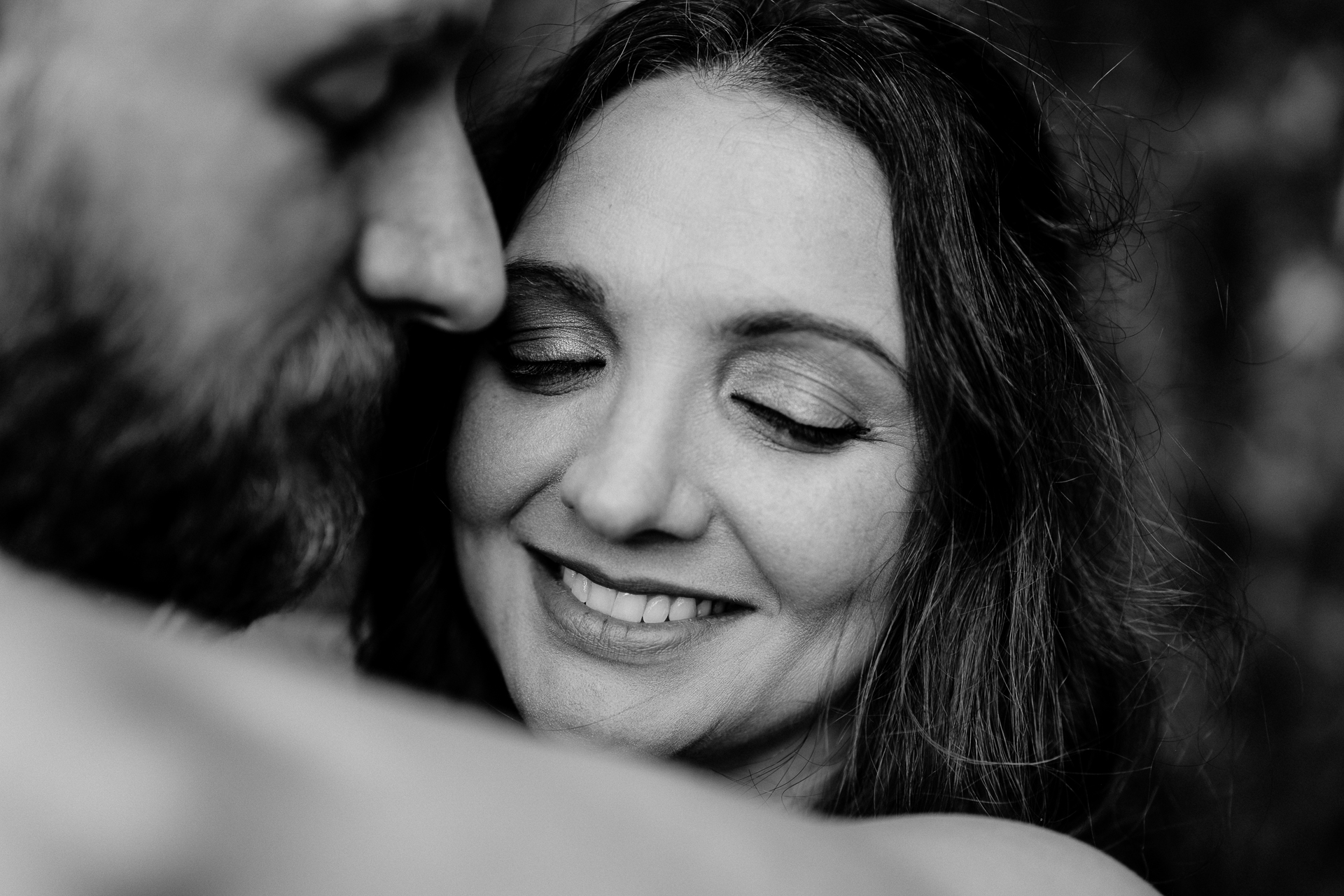 A man and woman smiling