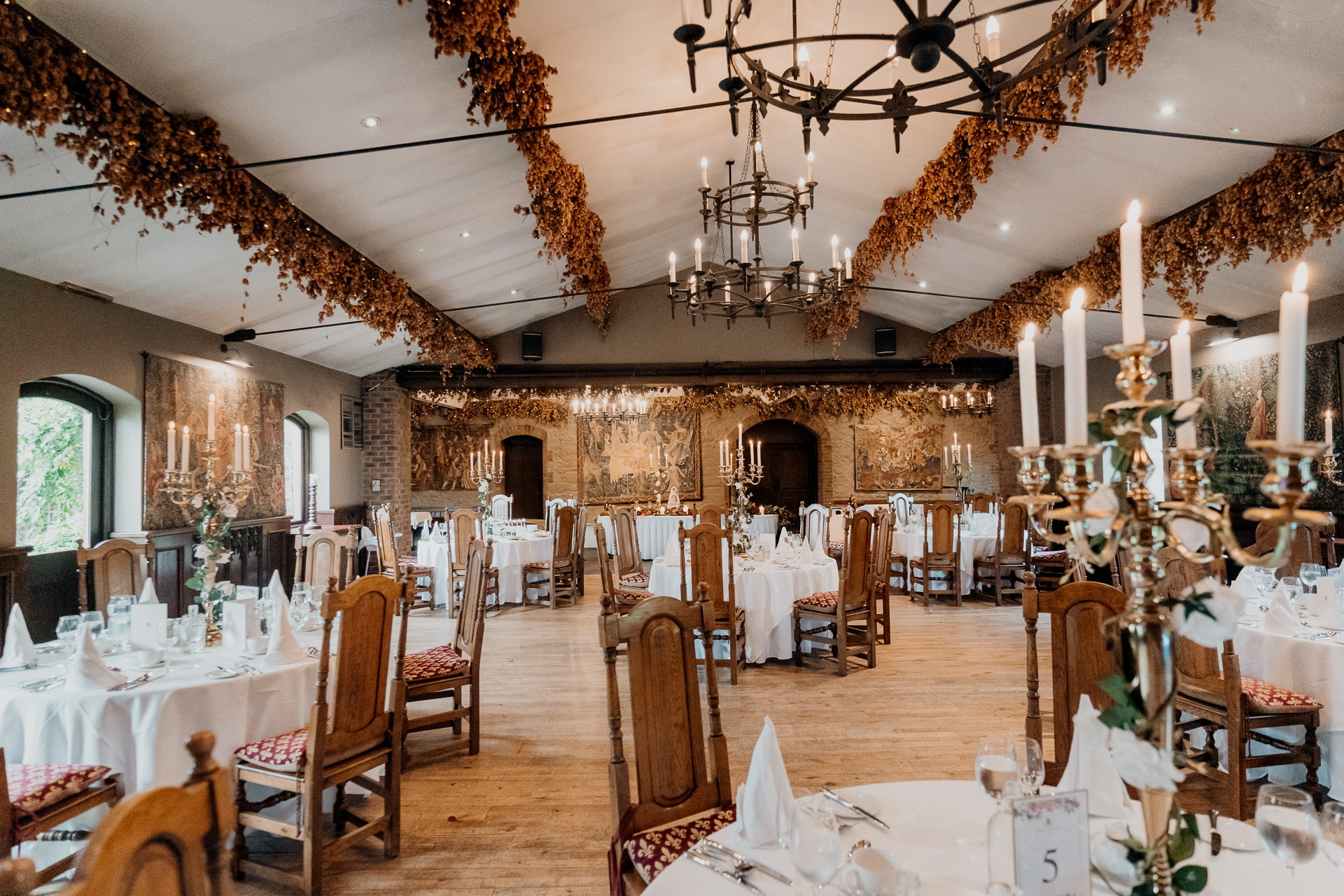 A large room with tables set for a meal