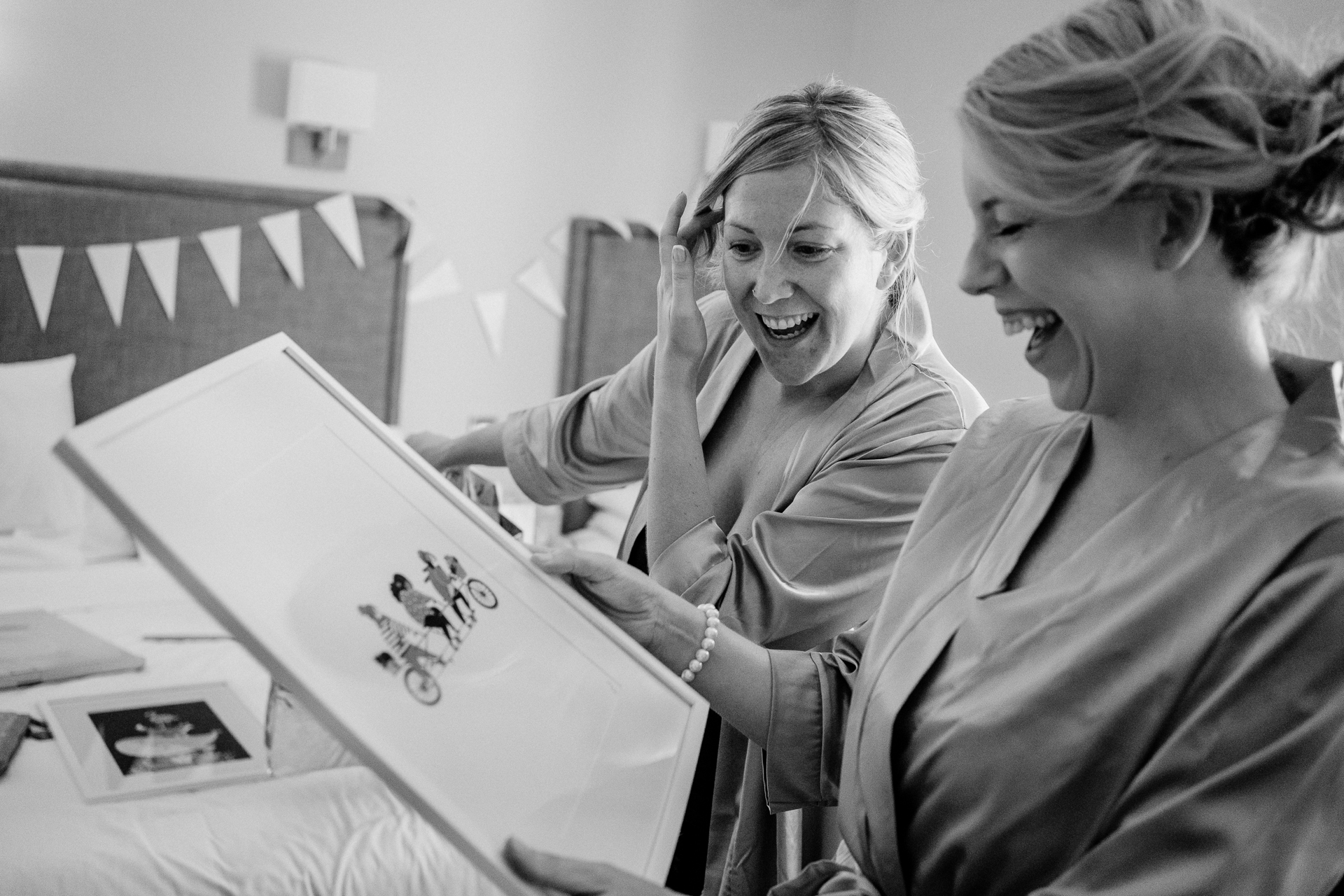 A person showing a person something on a laptop