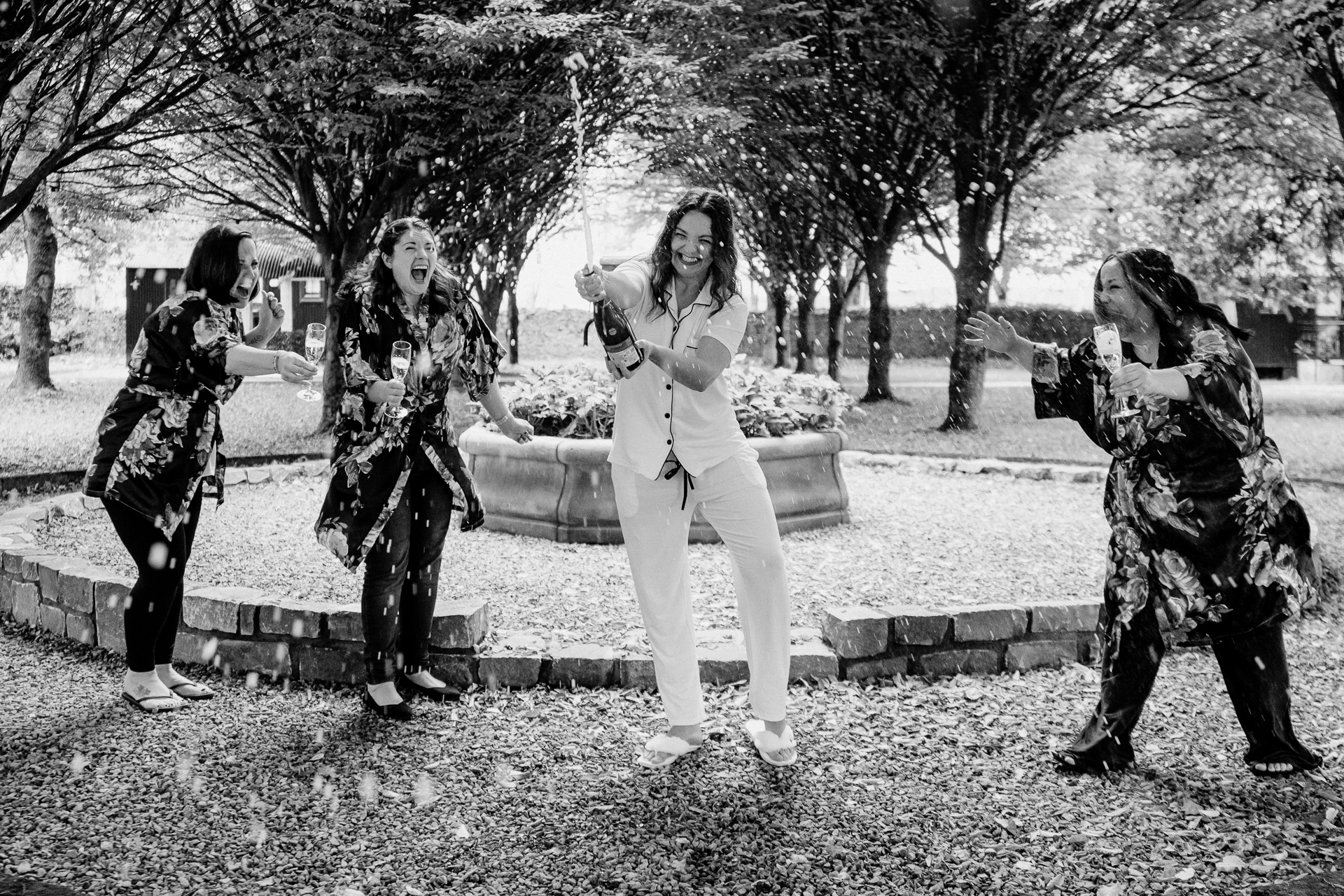 A group of people standing around a fountain