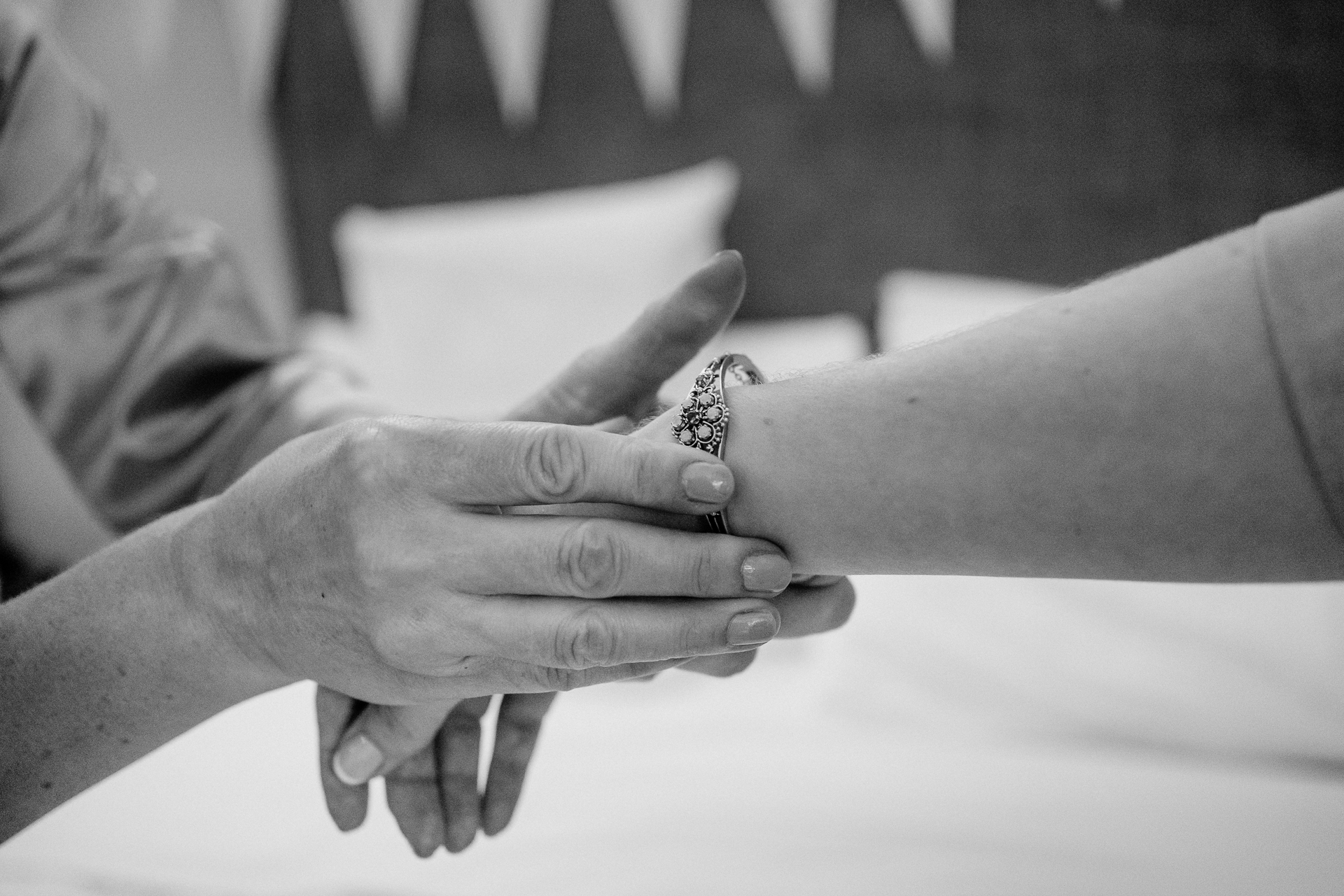 A pair of hands holding a piece of paper