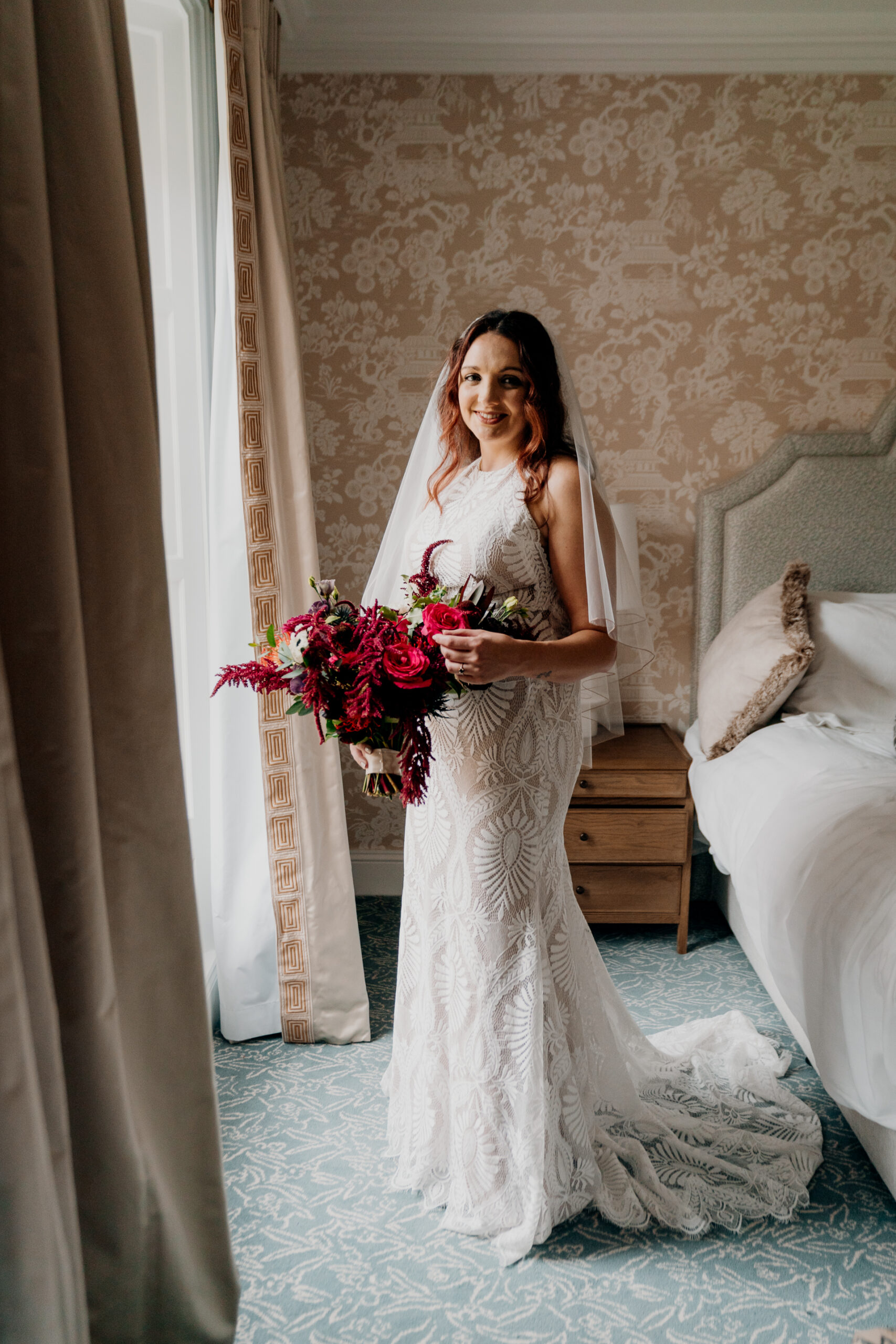 A woman in a white dress holding a bouquet of flowers