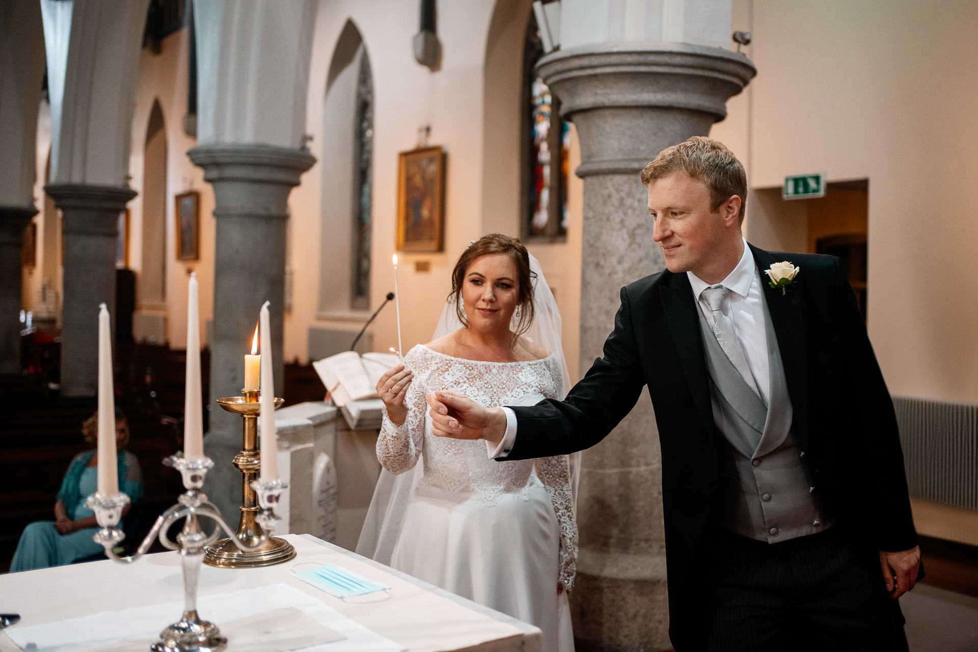 A bride and groom cutting their wedding cake