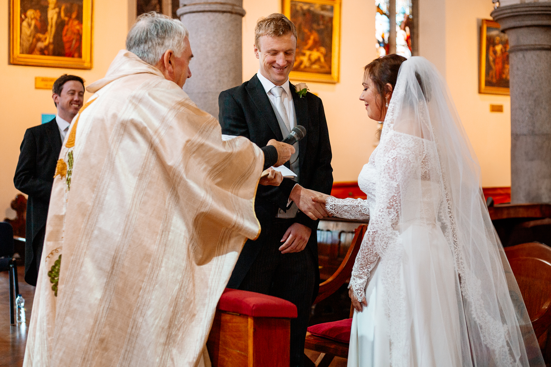 A man in a suit and a woman in a white dress