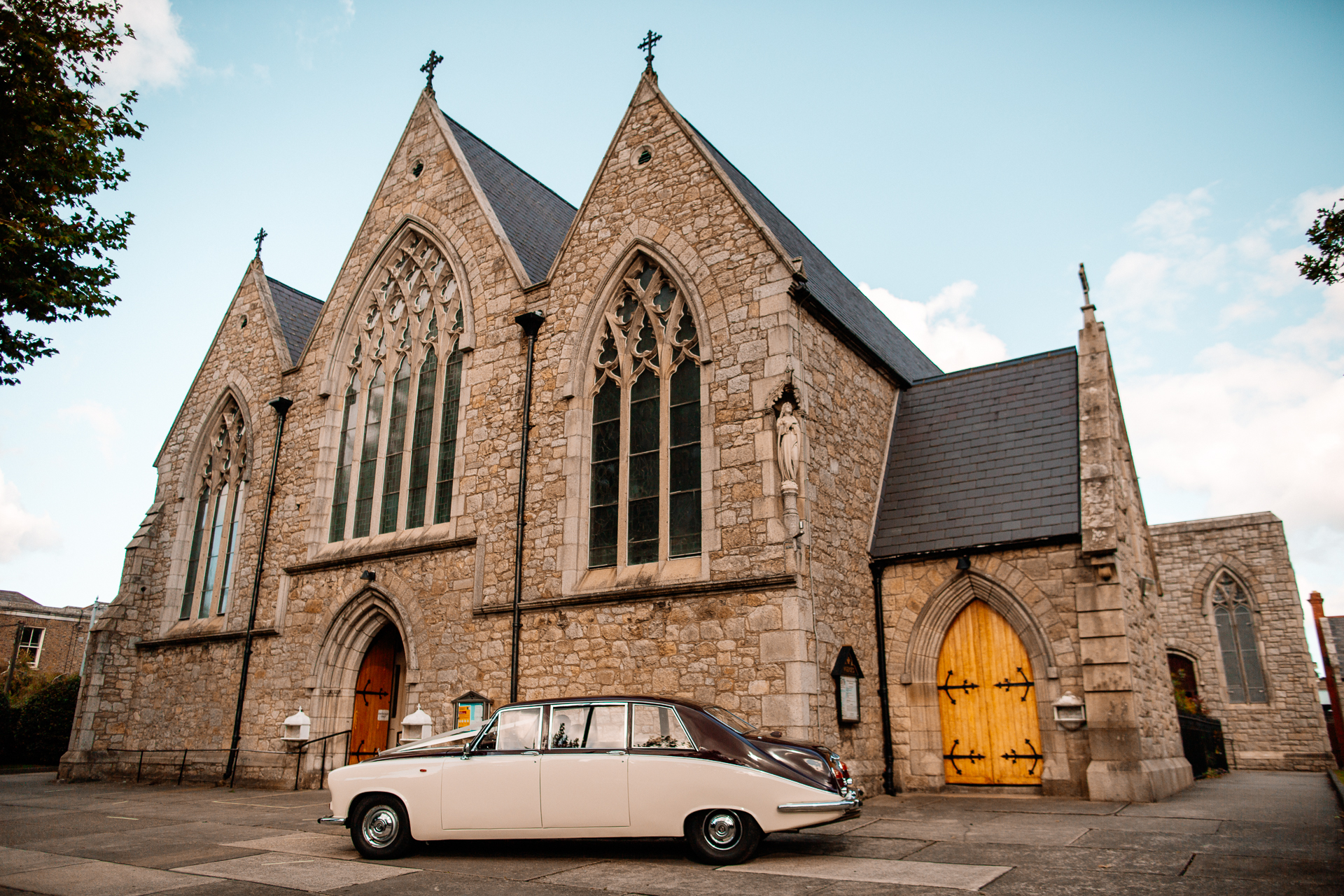 A car parked in front of a church