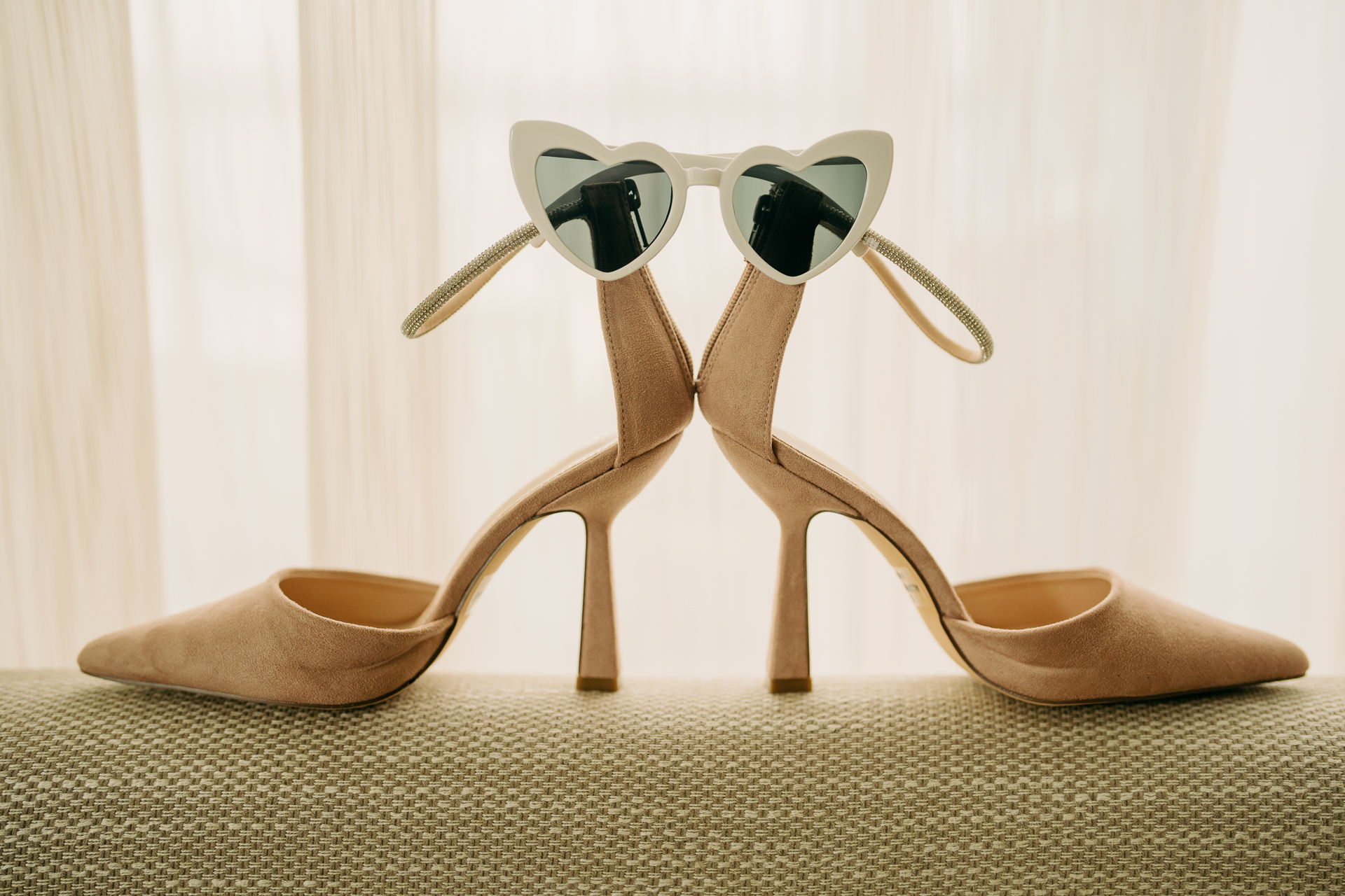 A pair of gold high heeled shoes