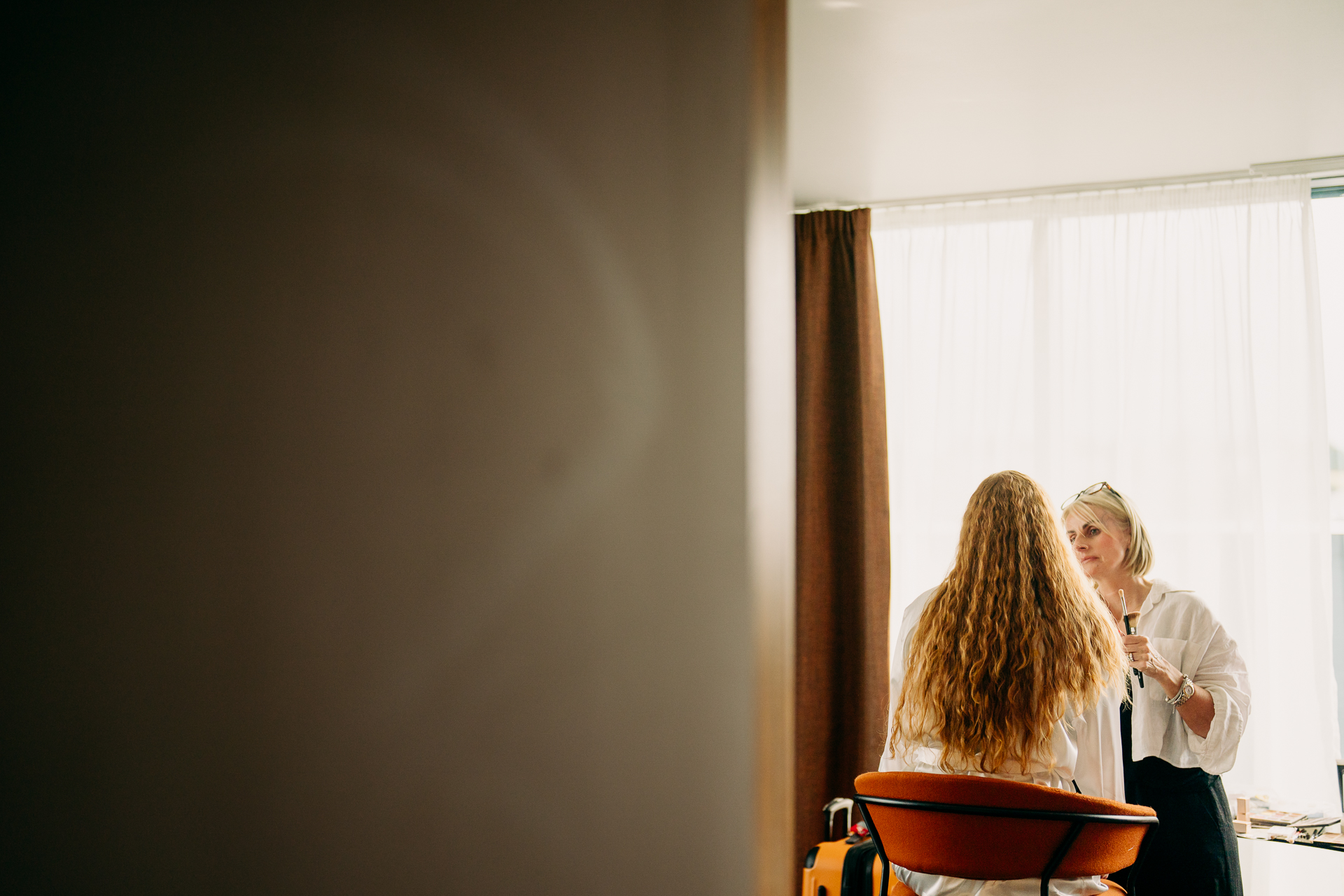 A person talking to another woman