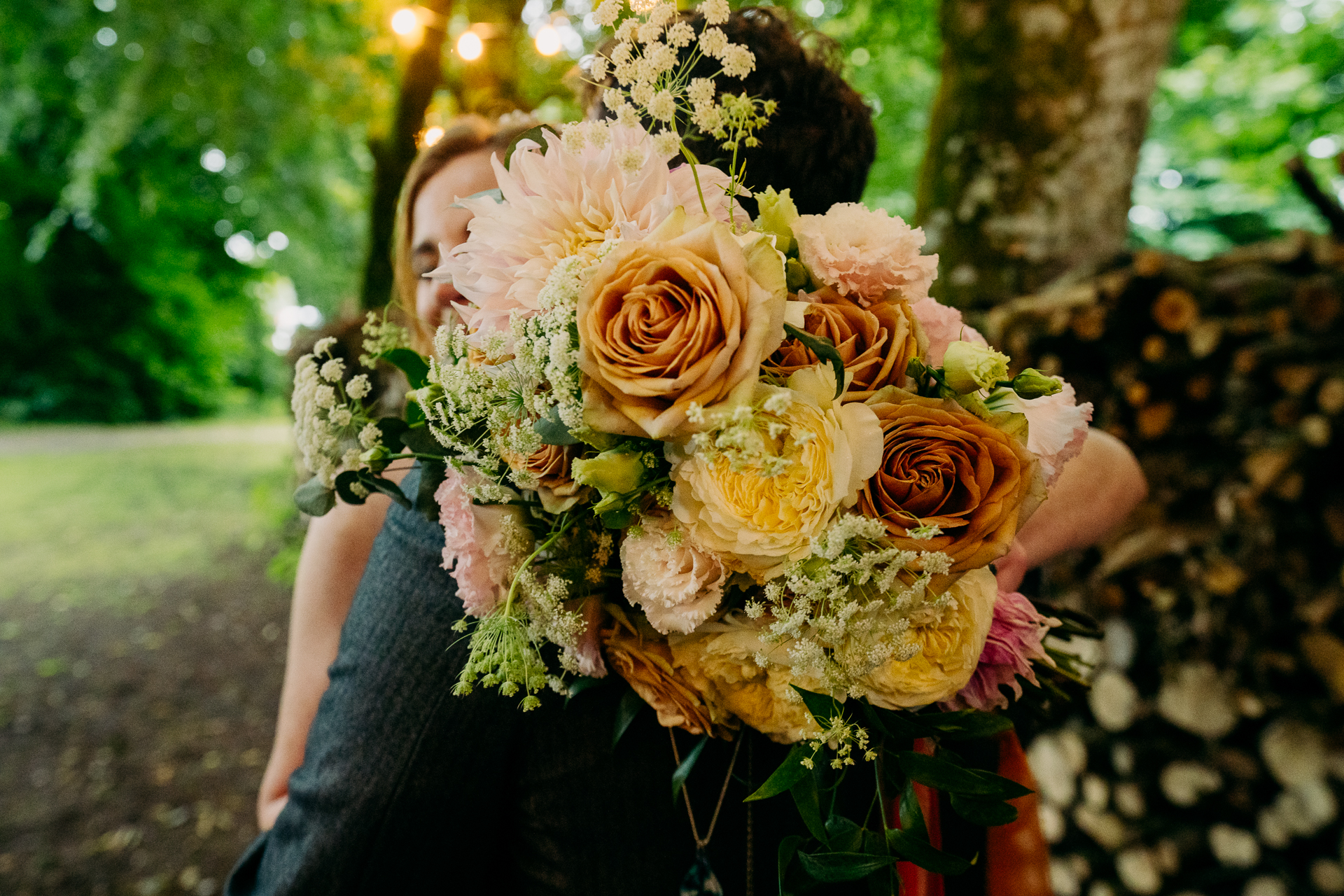 A person holding a bouquet of flowers