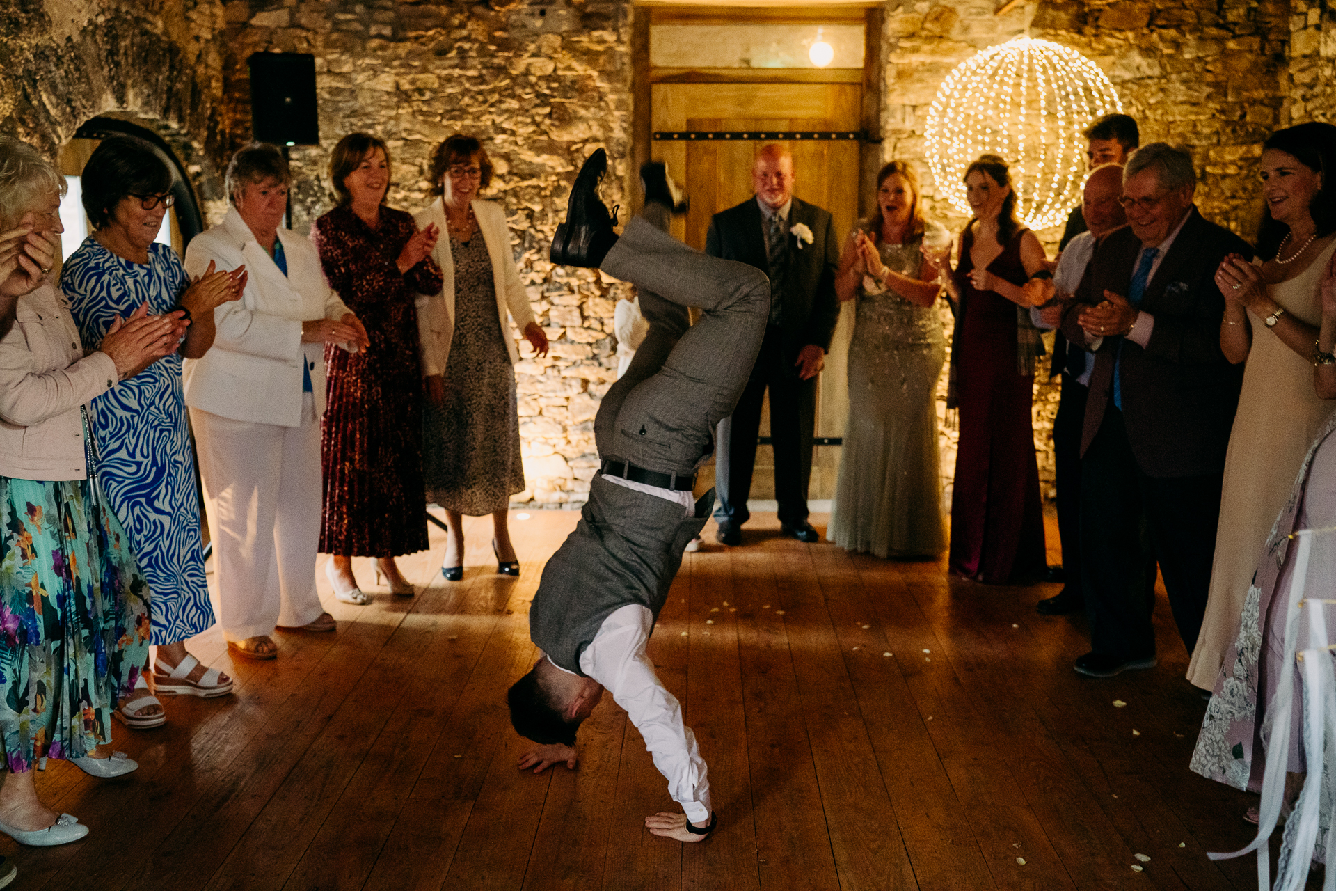 A person dancing in a room with a group of people