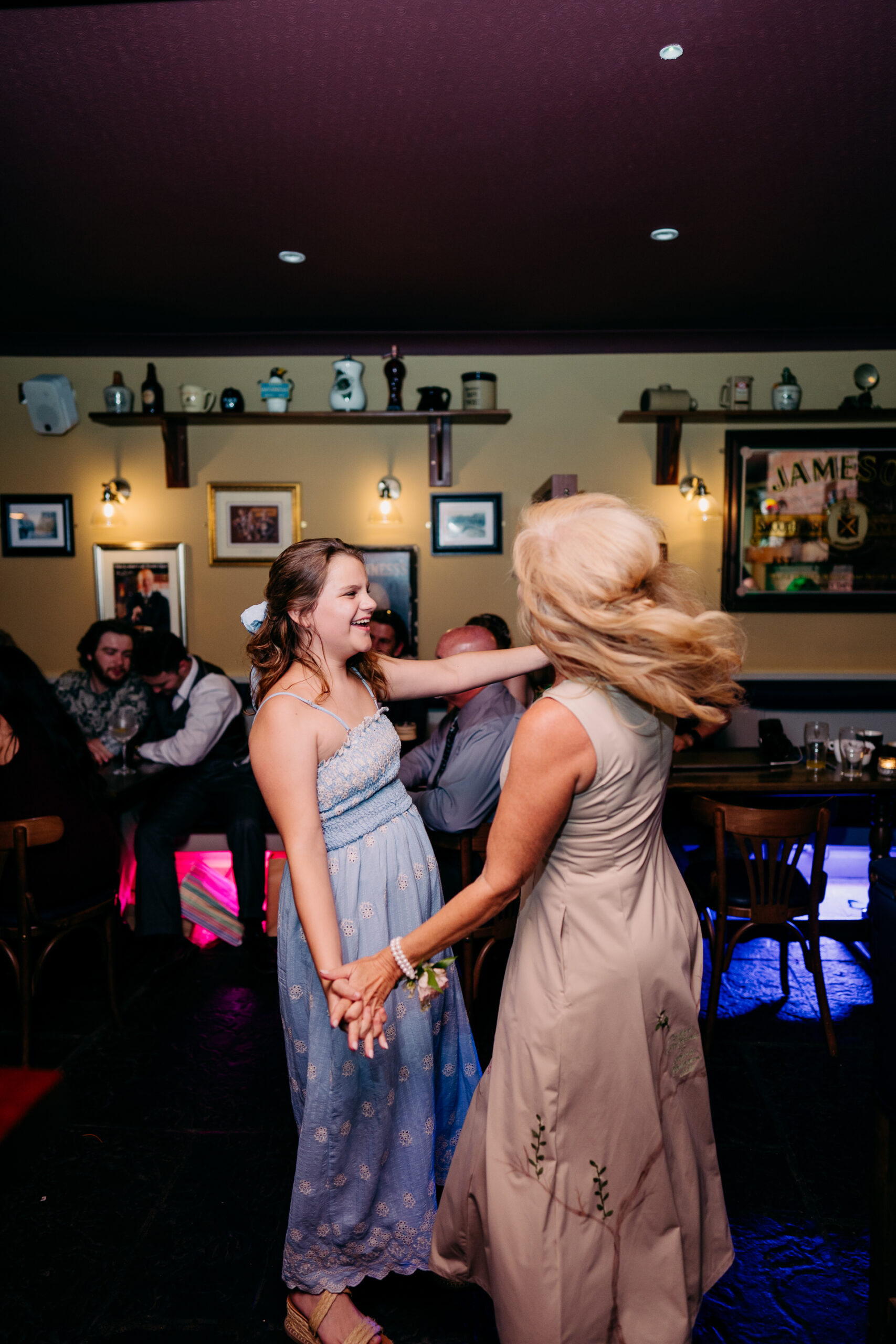 Two women dancing in a room